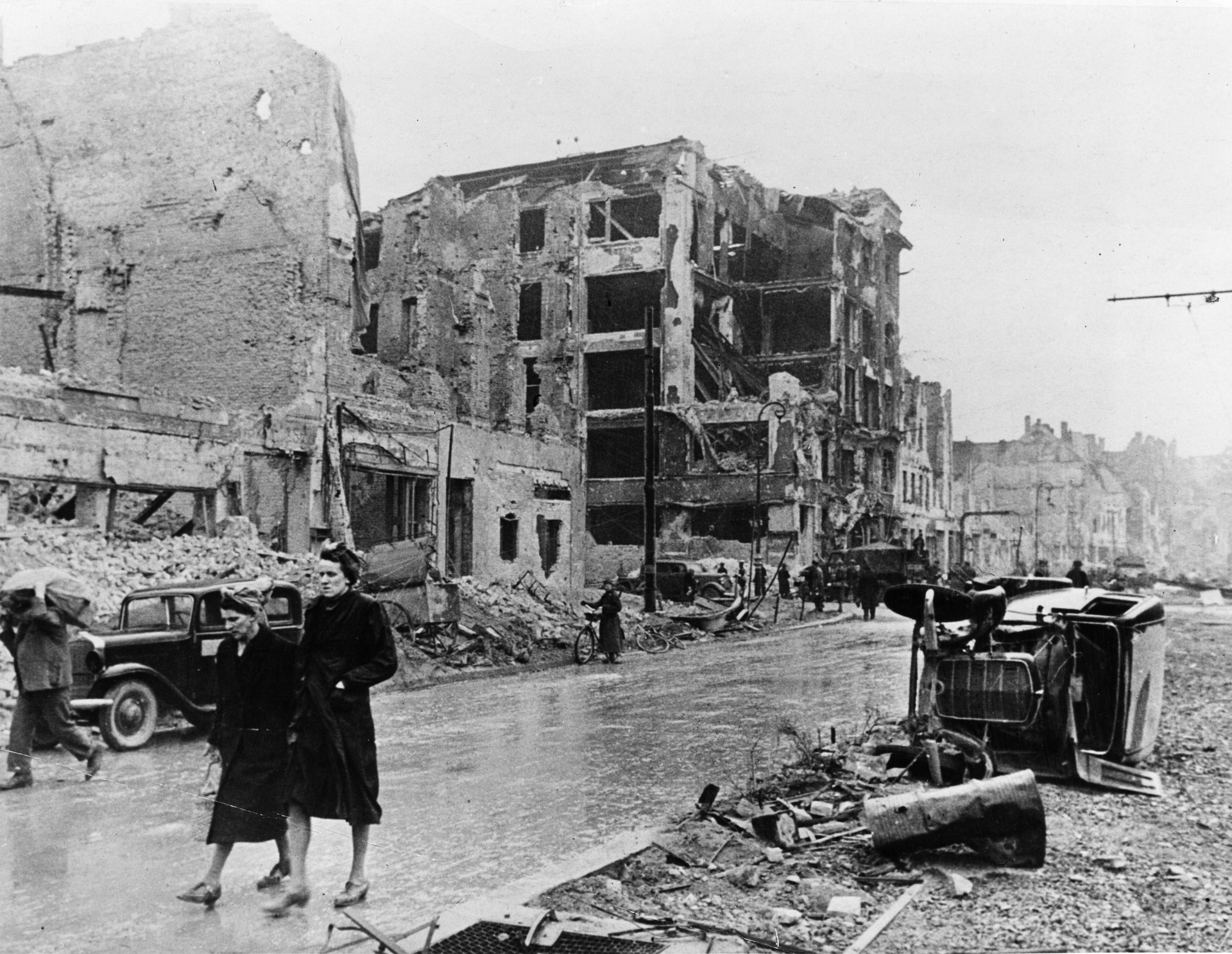 Berlin residents walk through the ruins of the city after it was taken by the Soviet Red Army, May 1945. Photo / Getty Images