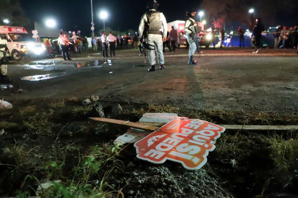 Electoral signs lay on the ground as security forces secure the area after a stage collapsed due to a gust of wind during an event attended by presidential candidate Jorge Alvarez Maynez in San Pedro Garza Garcia, on the outskirts of Monterey, Mexico. Photo / AP