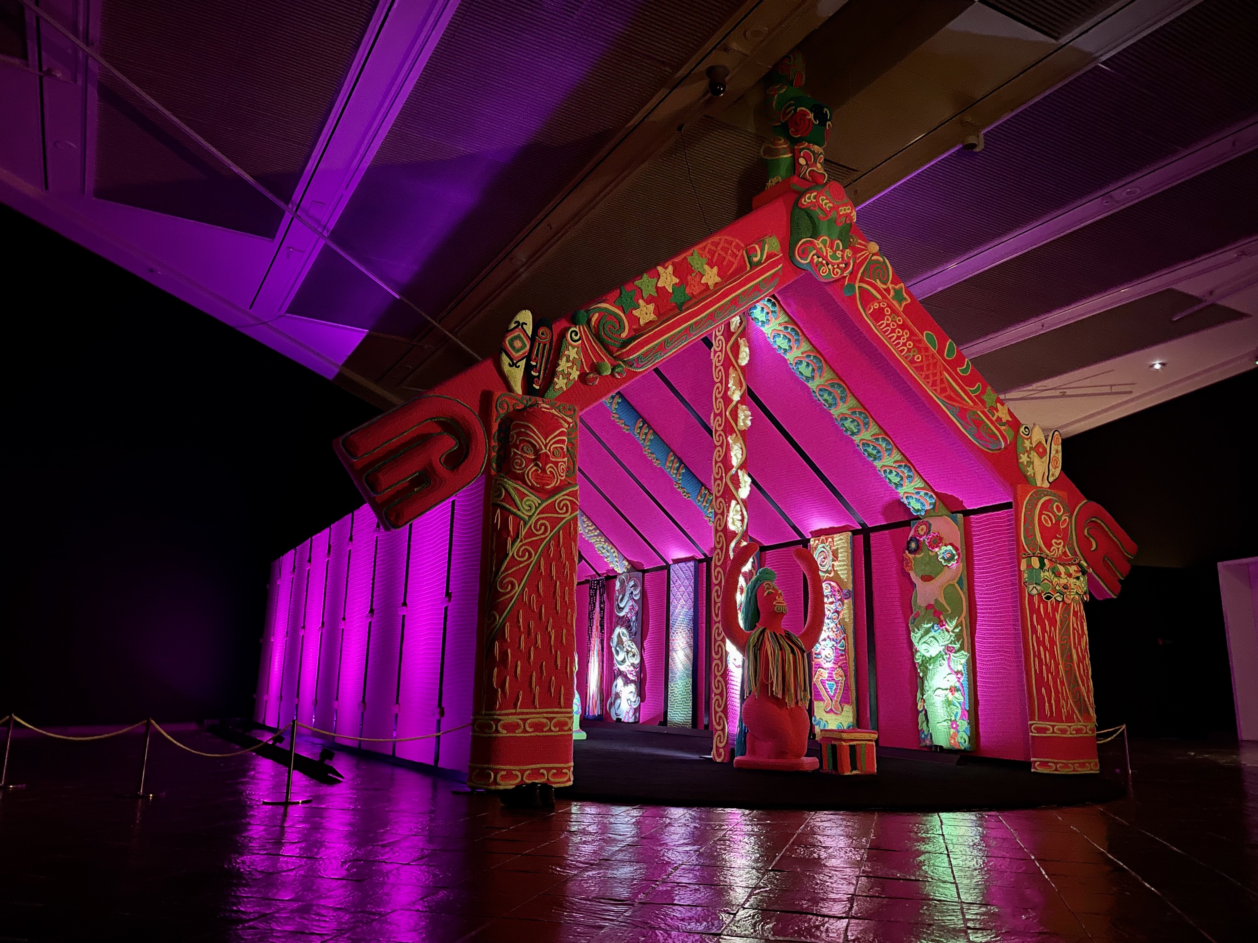 The neon-wool crocheted Wharenui Harikoa, created by Lissy (Ngāti Hine, Ngāti Kahu) and Rudi Robinson-Cole (Taranaki, Ngāti Pāoa, Waikato, Ngāti Tahu/Ngāti Whaoa). Photo / Samuel Evans