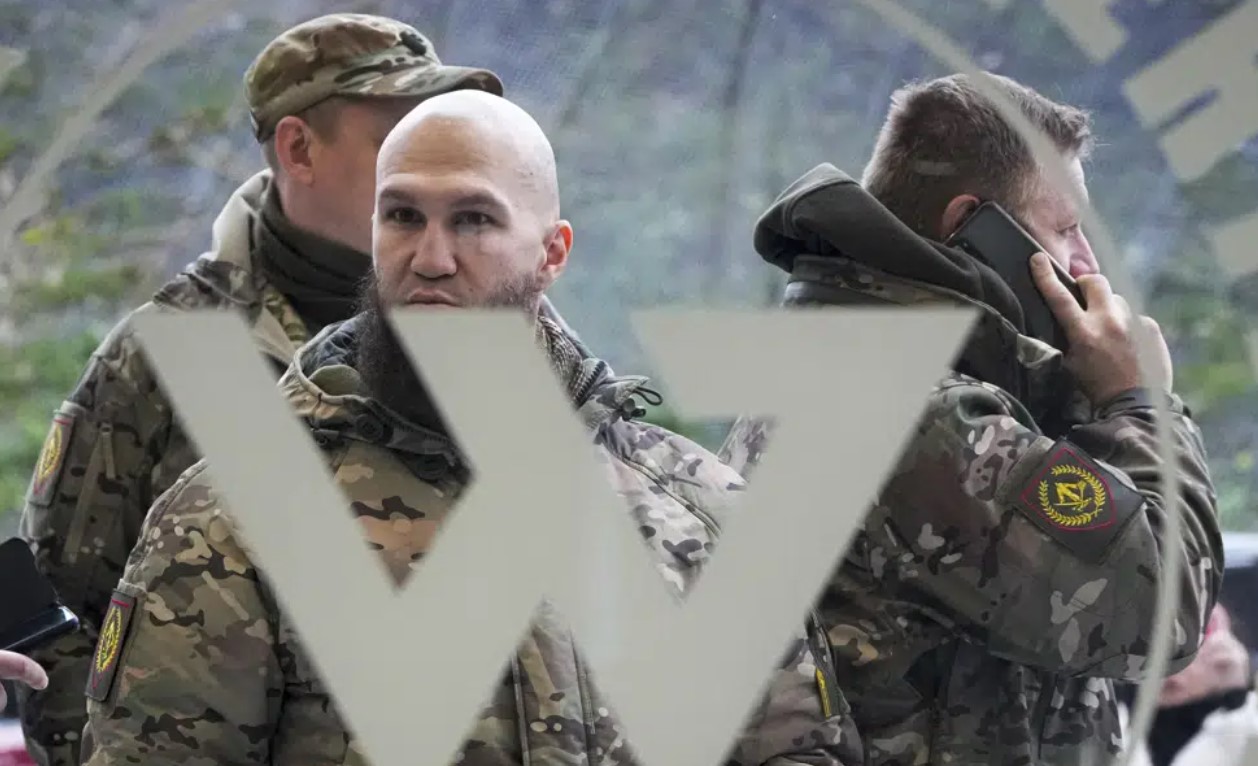 Visitors wearing military camouflage stand at the entrance of the 'PMC Wagner Centre', which is associated with businessman and founder of the Wagner private military group Yevgeny Prigozhin. Photo / AP, File