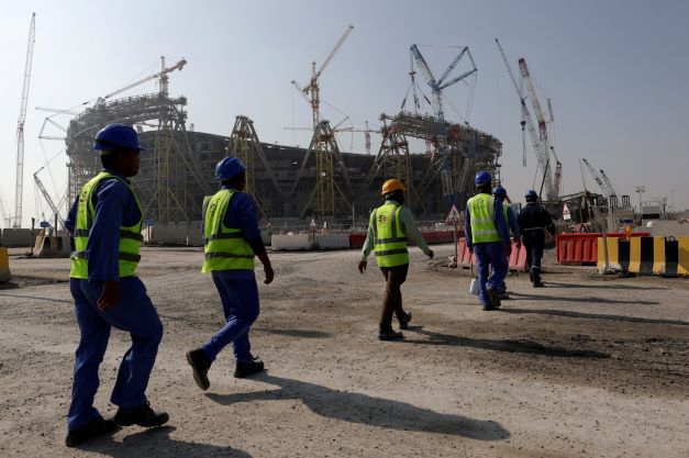 Workers walk to the Lusail Stadium, one of the 2022 World Cup stadiums, in Lusail, Qatar in December 20, 2019.  Photo / AP 
