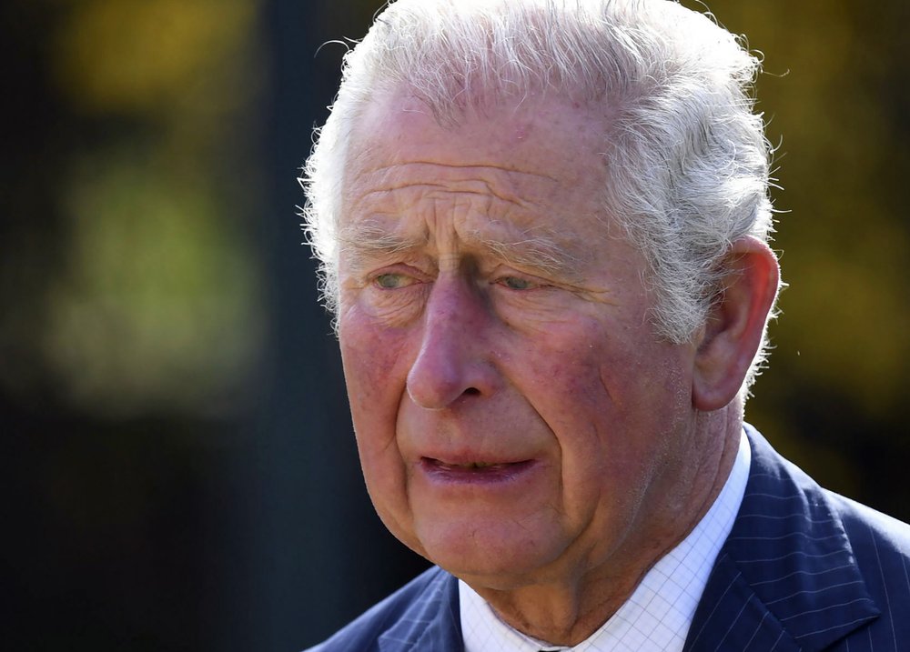 A mournful Prince Charles visited tributes to his father. Photo / Getty Images