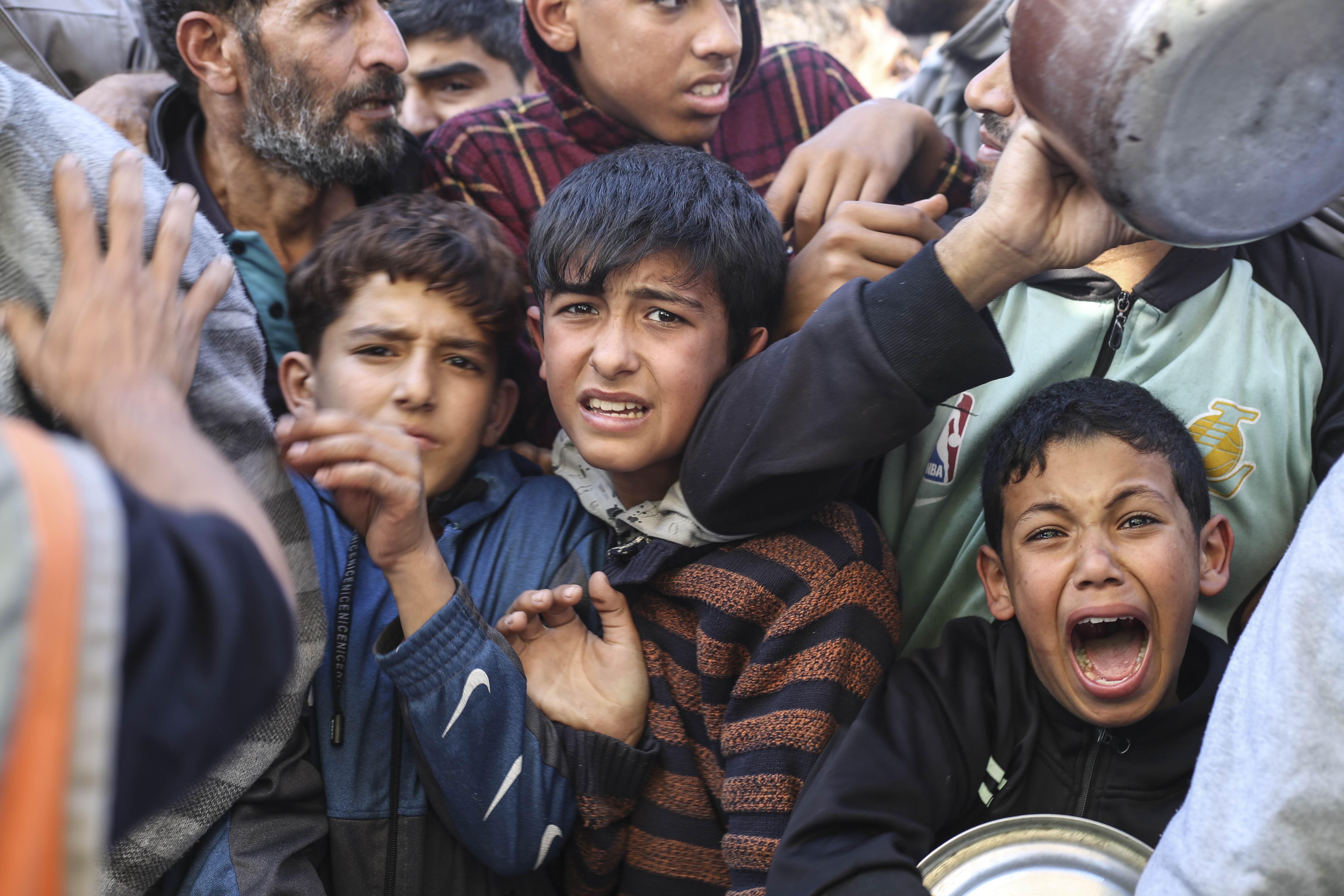 Palestinians line up for food in Rafah, Gaza Strip. Photo / AP