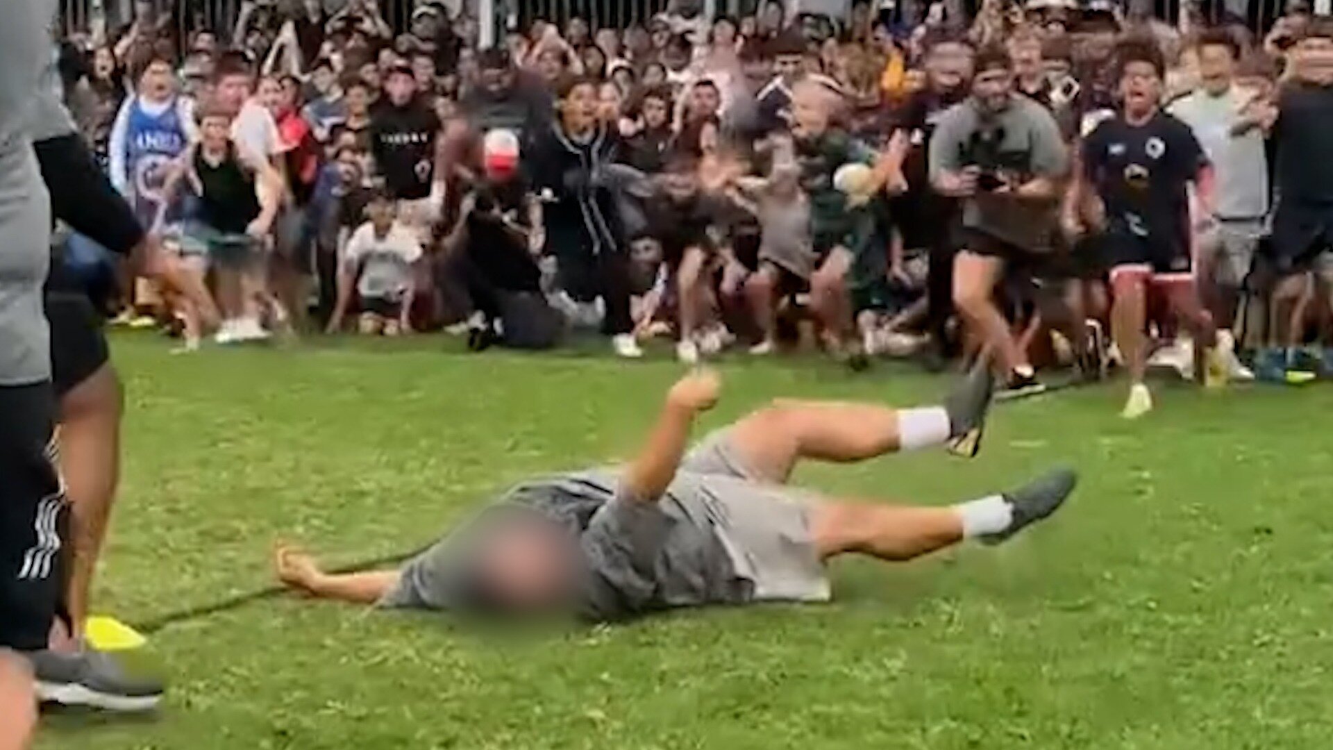 A viral video last month showed a man being knocked unconscious and suffering an apparent seizure during an event in Australia as hundreds of children watched on. Photo / TikTok