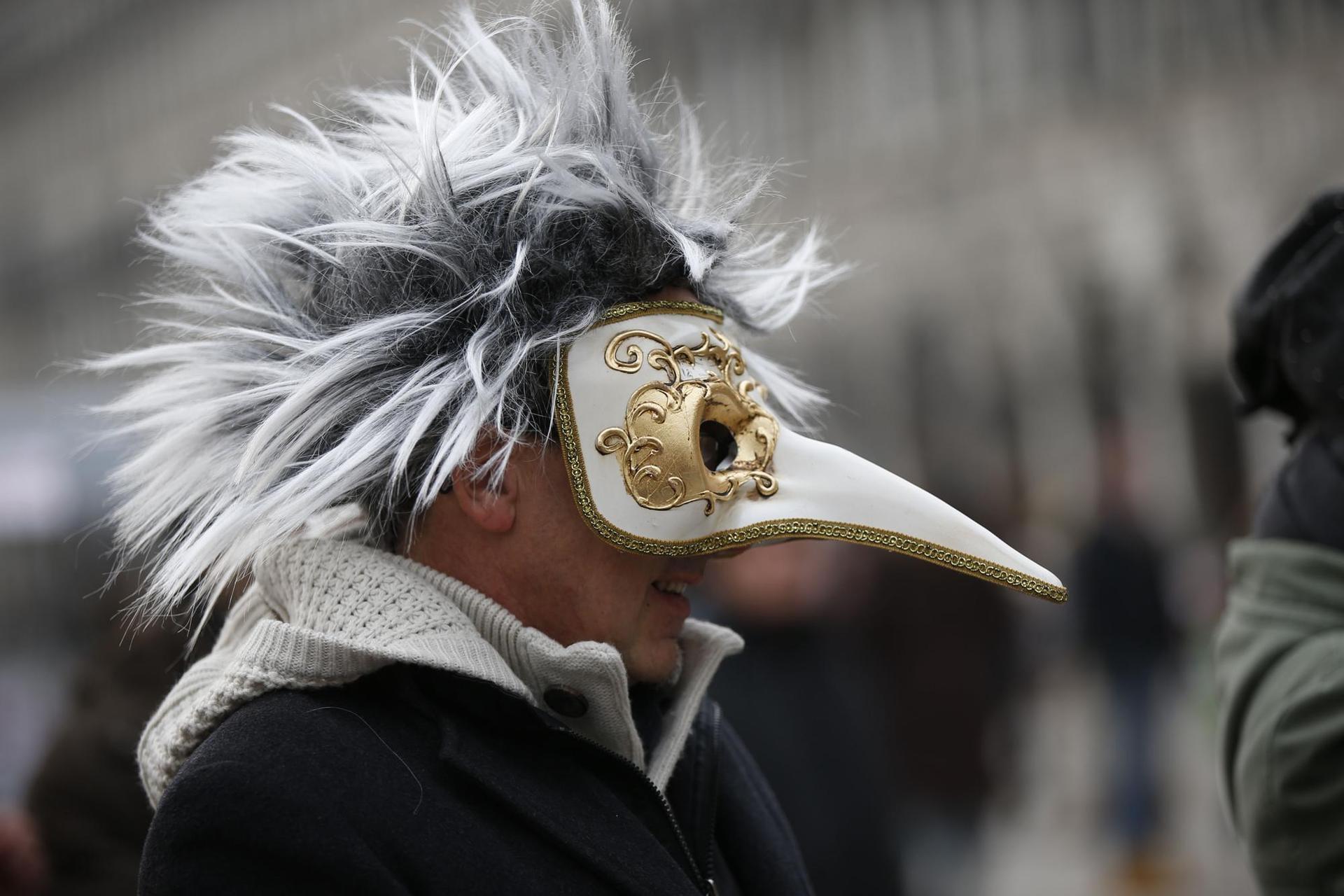 A tourist wears a pest doctor mask in St Mark's Square in Venice, Italy. Photo / AP, Luca Bruno