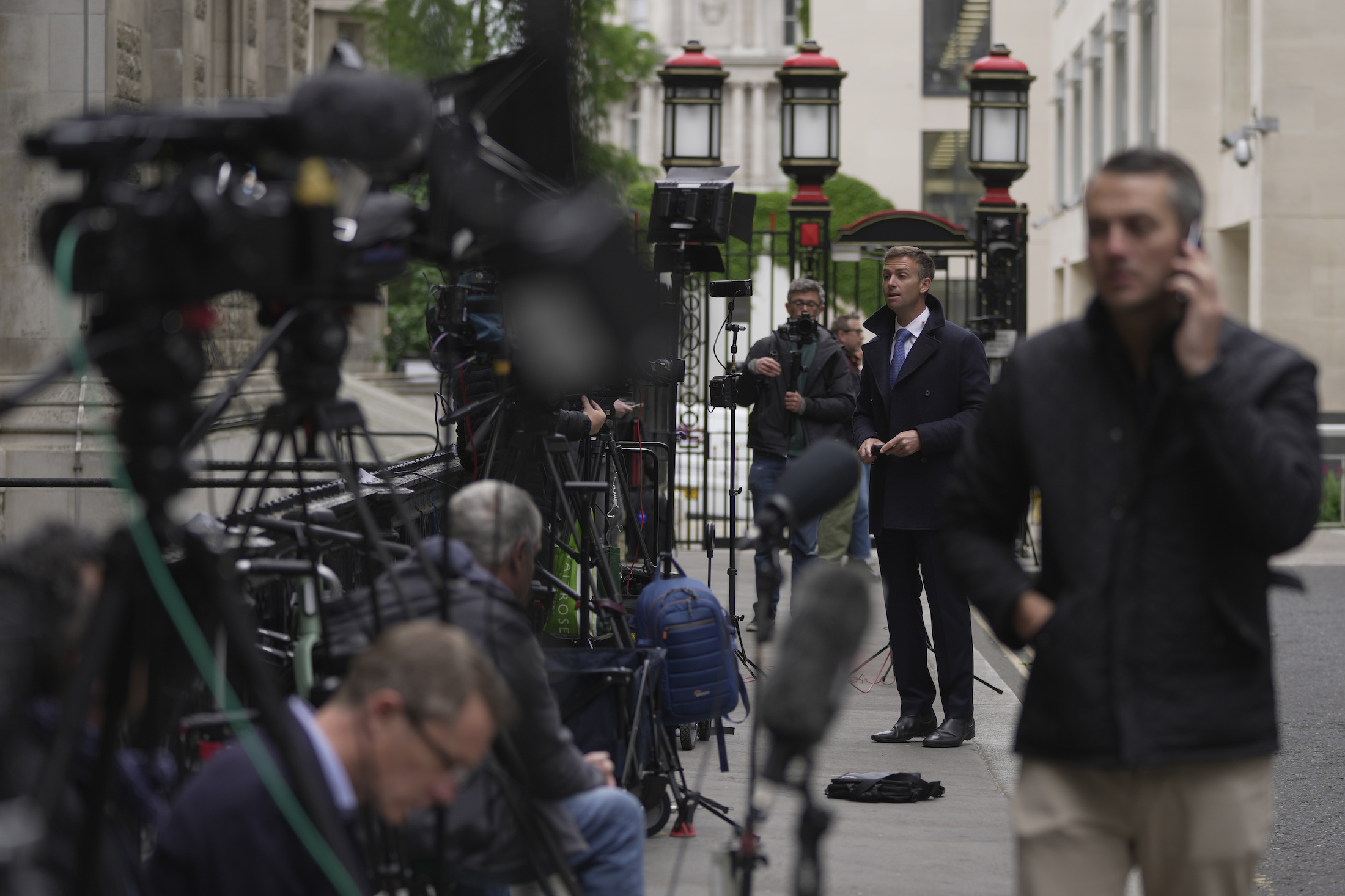 Media waits outside the High Court for the arrival of Prince Harry in London. Photo / AP
