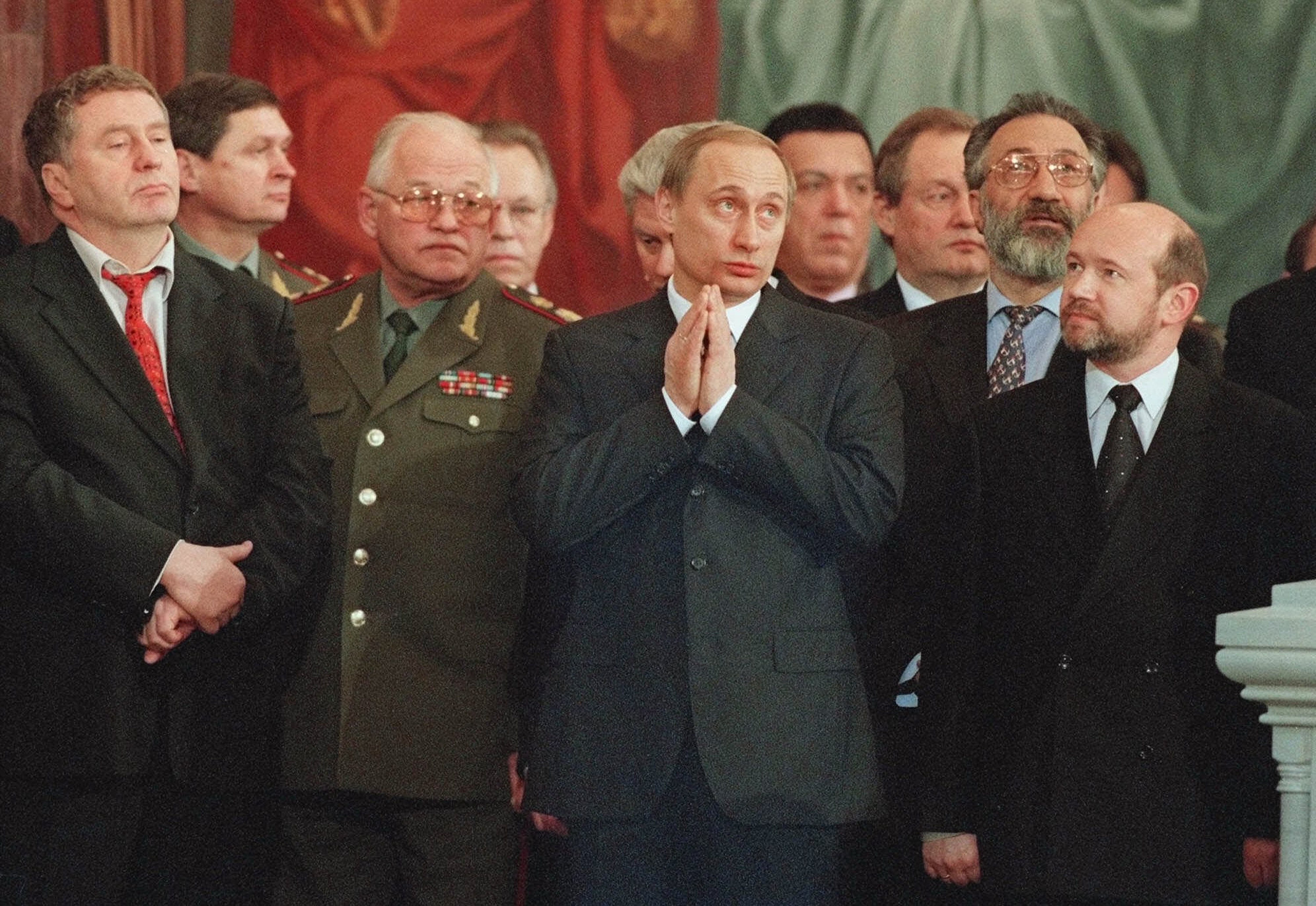 Vladimir Putin, centre, attends a Christmas service in Christ the Savior Cathedral in Moscow, on January 8, 2000. 