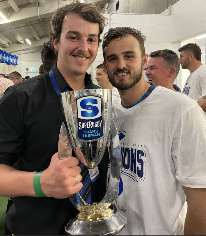 Benjamin, left, and Harry Plummer in the Eden Park changing rooms after the Blues won the 2021 Super Rugby Trans-Tasman competition in 2021.