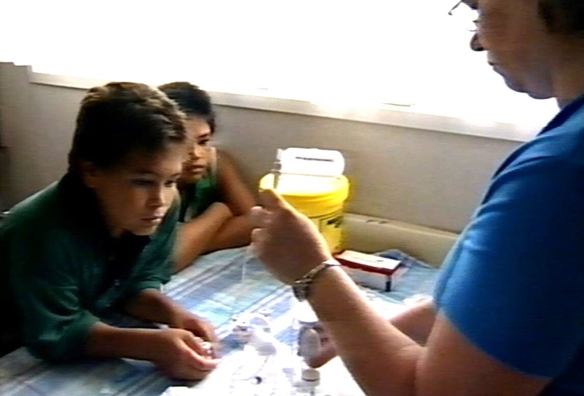 Mitioti Fariu (left) at home aged 11 with a Kidz First community nurse, Karen Malloy. Photo / Greenstone TV