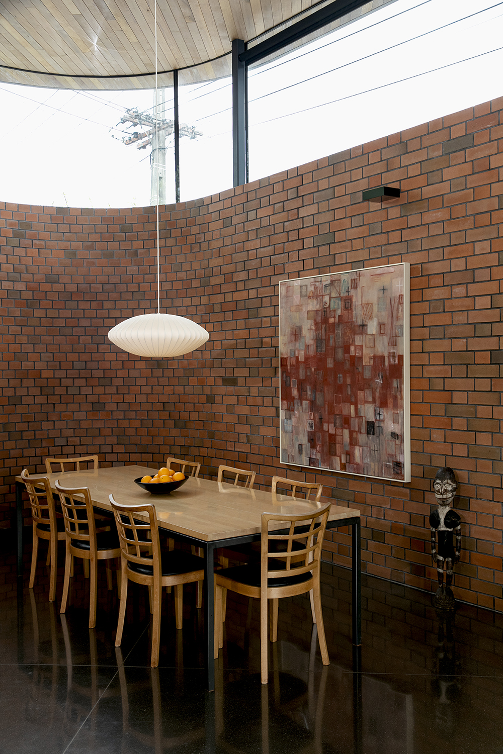 The dining area, featuring brick, polished concrete floors and an exquisite cedar ceiling. Photo / Babiche Martens