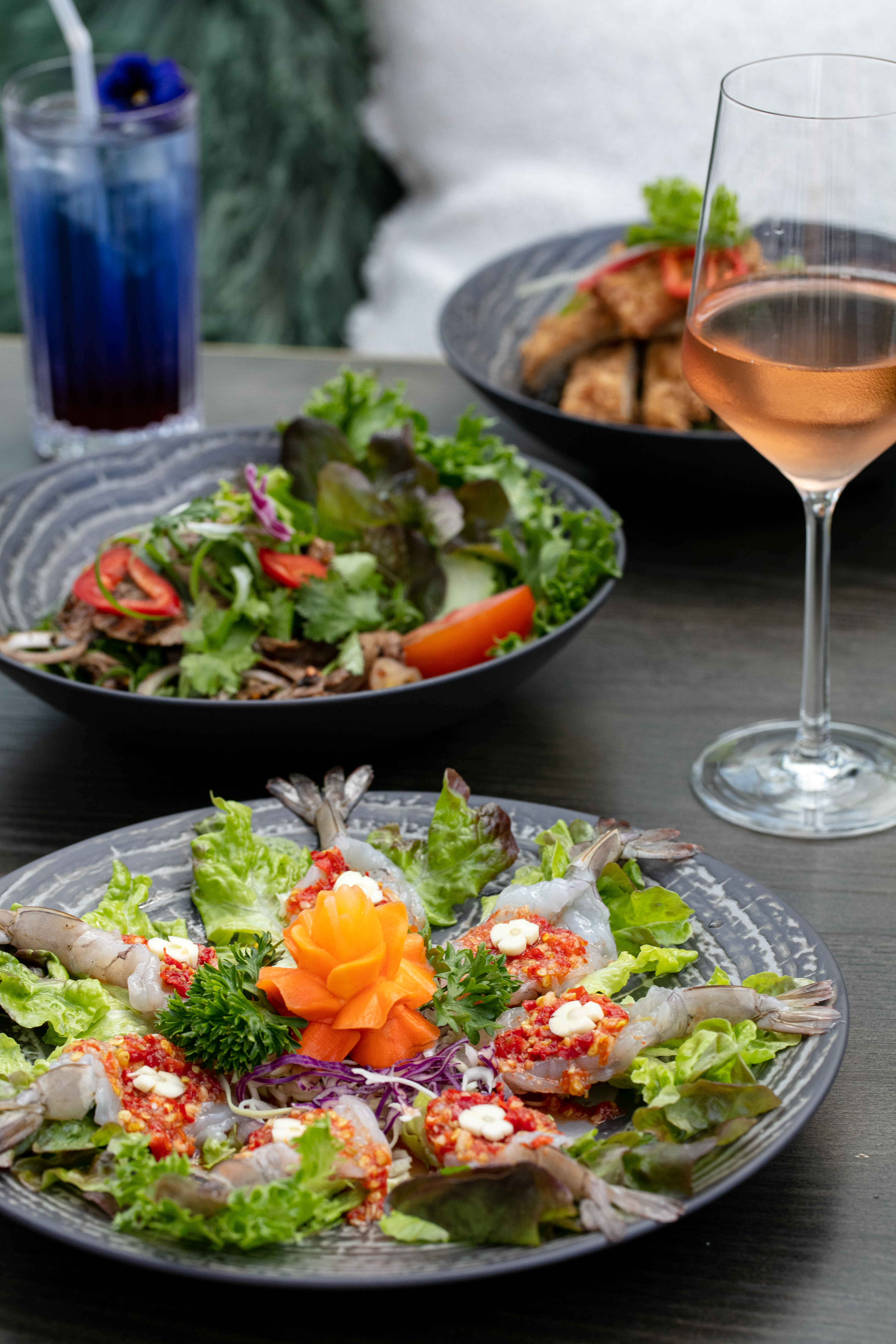 The raw prawns, “beef waterfall” salad and crunchy pork at Thai Village, Remuera. Photo / Babiche Martens