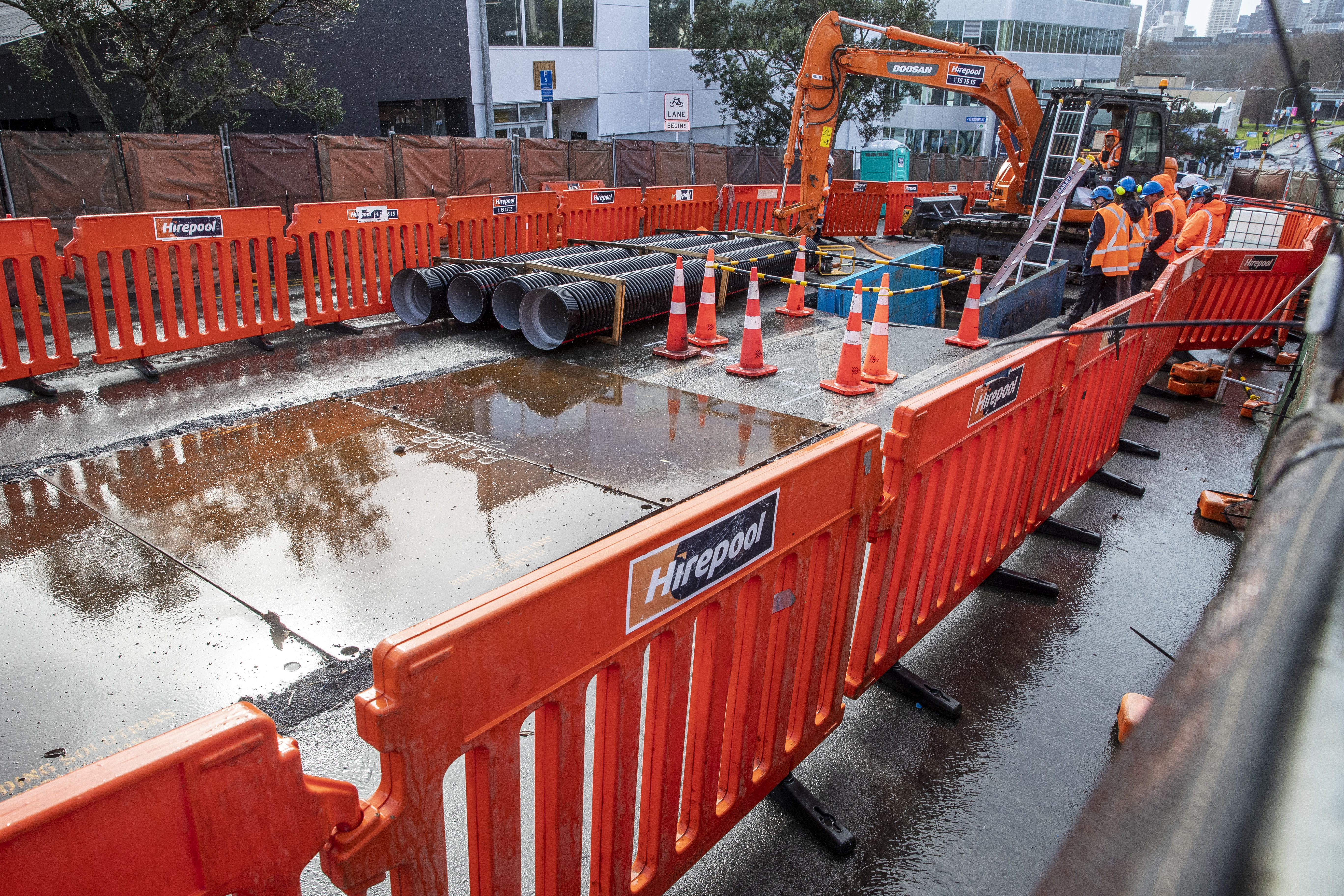 The sinkhole has been fenced off for work on a temporary fix. Photo / Michael Craig