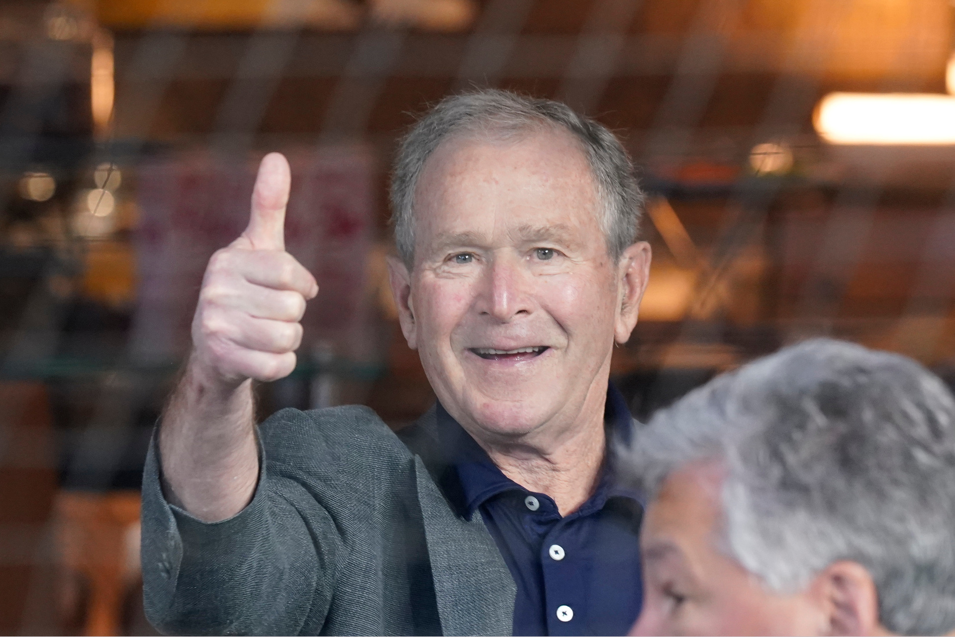Former President George W Bush gives a thumbs-up before a baseball game in Arlington, Texas. Photo / AP