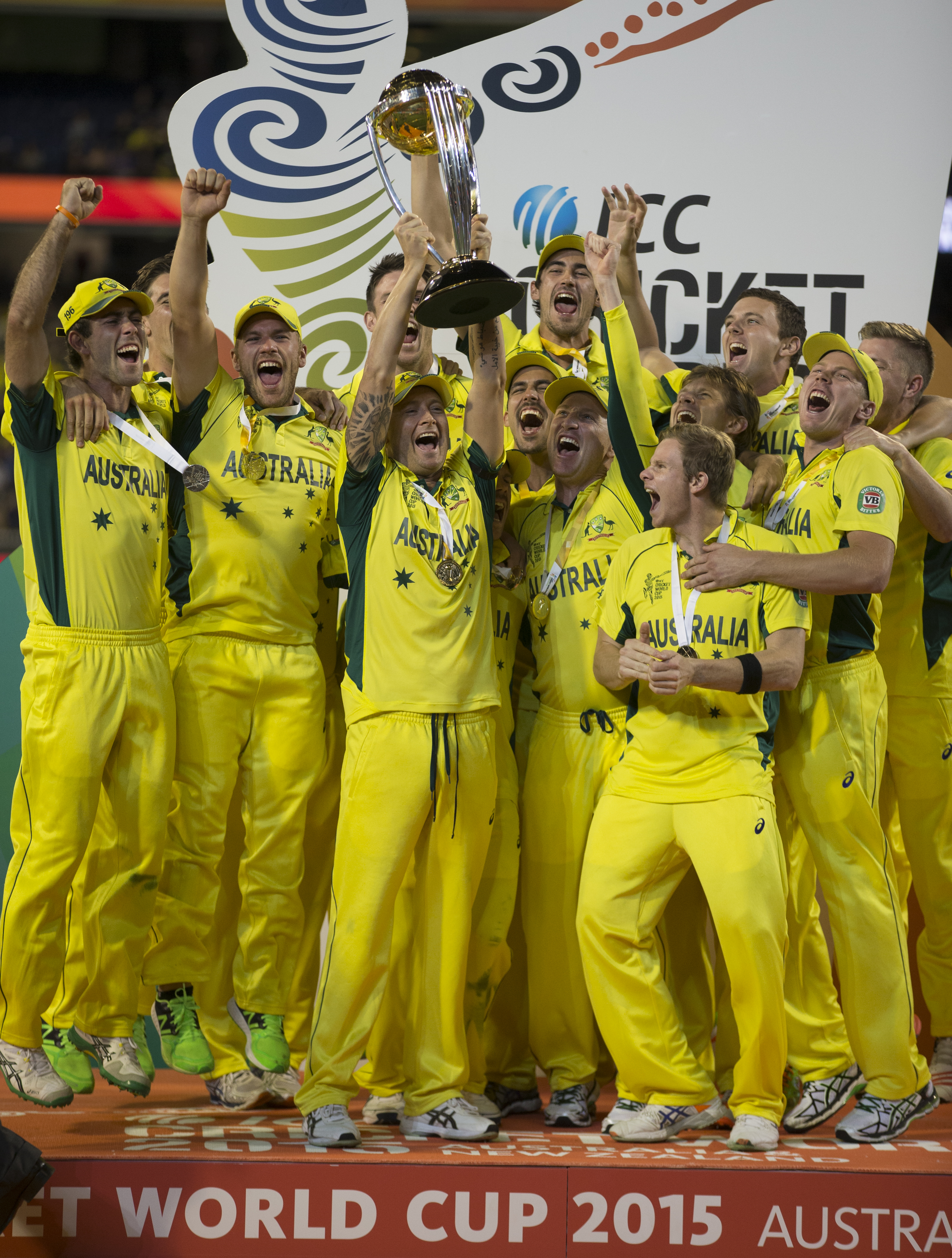 Australian captain Michael Clarke and his team hold aloft the Cricket World Cup after beating New Zealand at the Melbourne Cricket Ground (MCG) in the final. Photo / NZ Herald / Brett Phibbs
