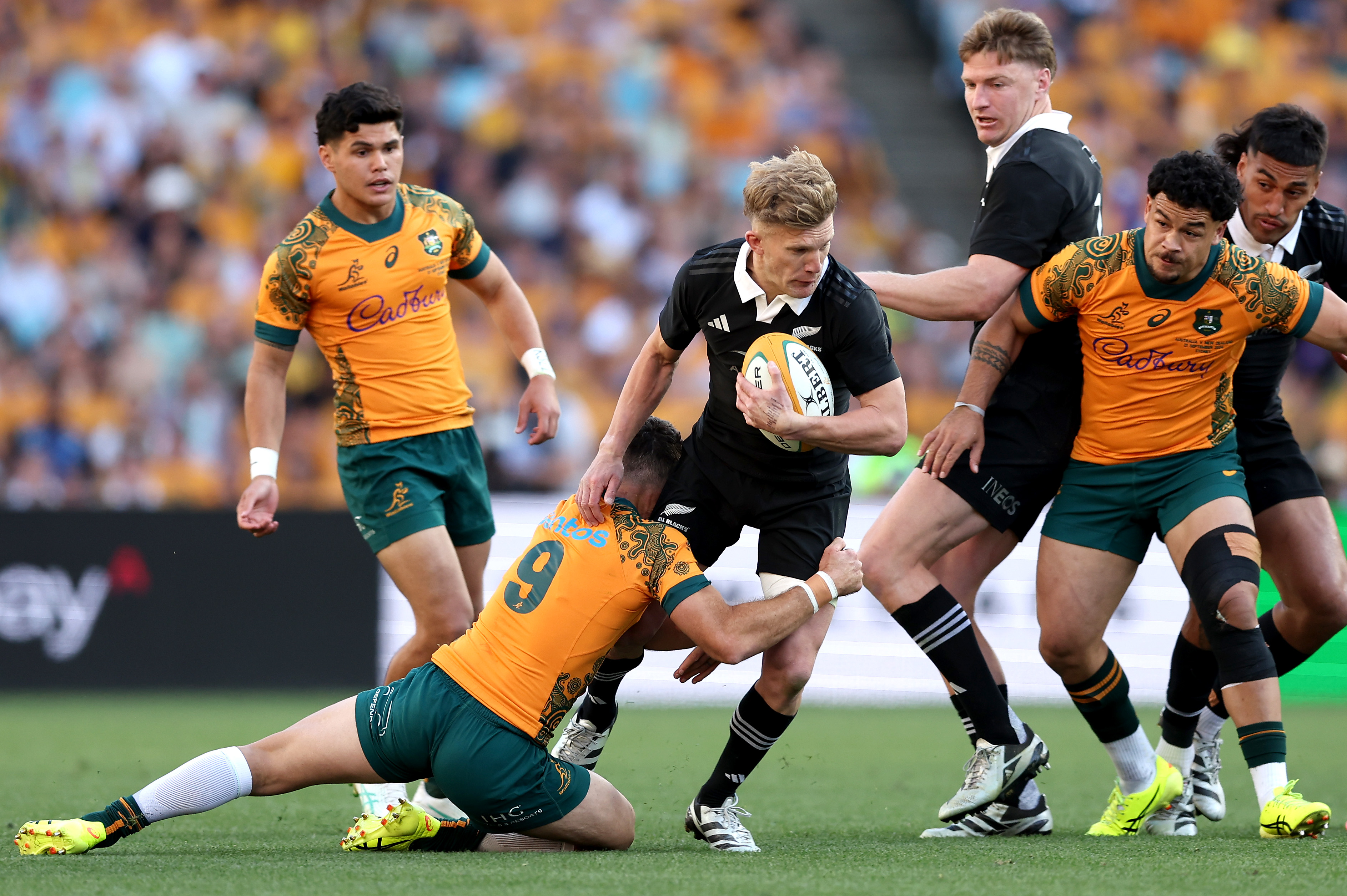 Damian McKenzie is tackled against Australia. Photo / Getty Images