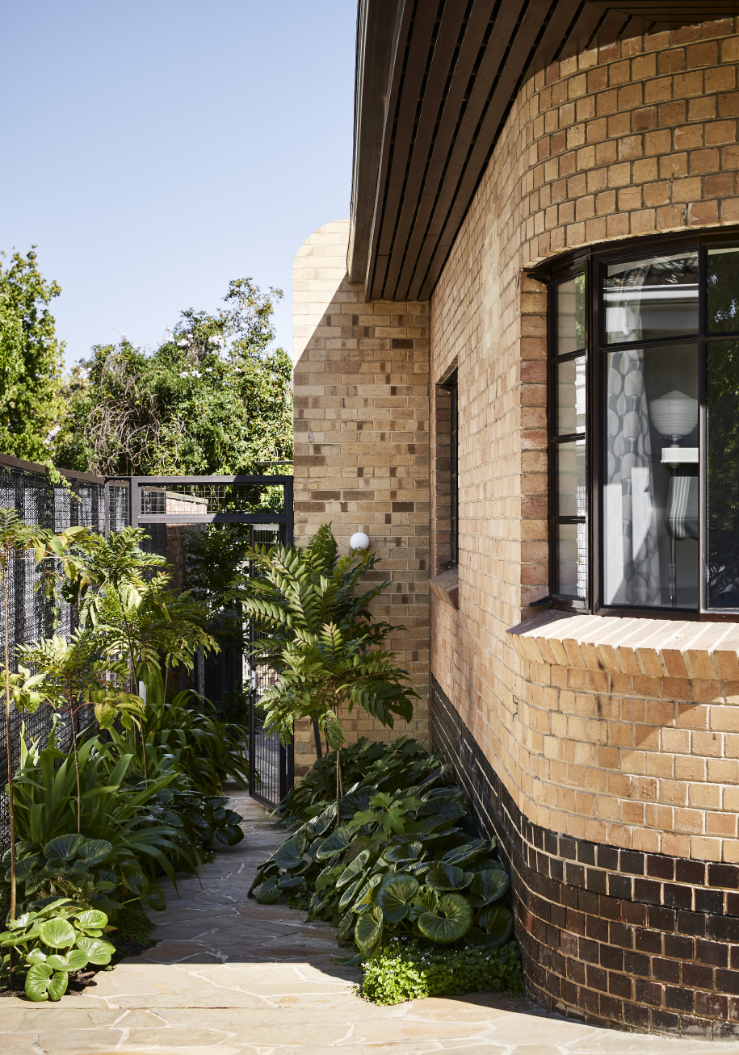 The monolithic, sculptural, cream-brick addition references the curved forms of the original facade. Photo / Tess Kelly