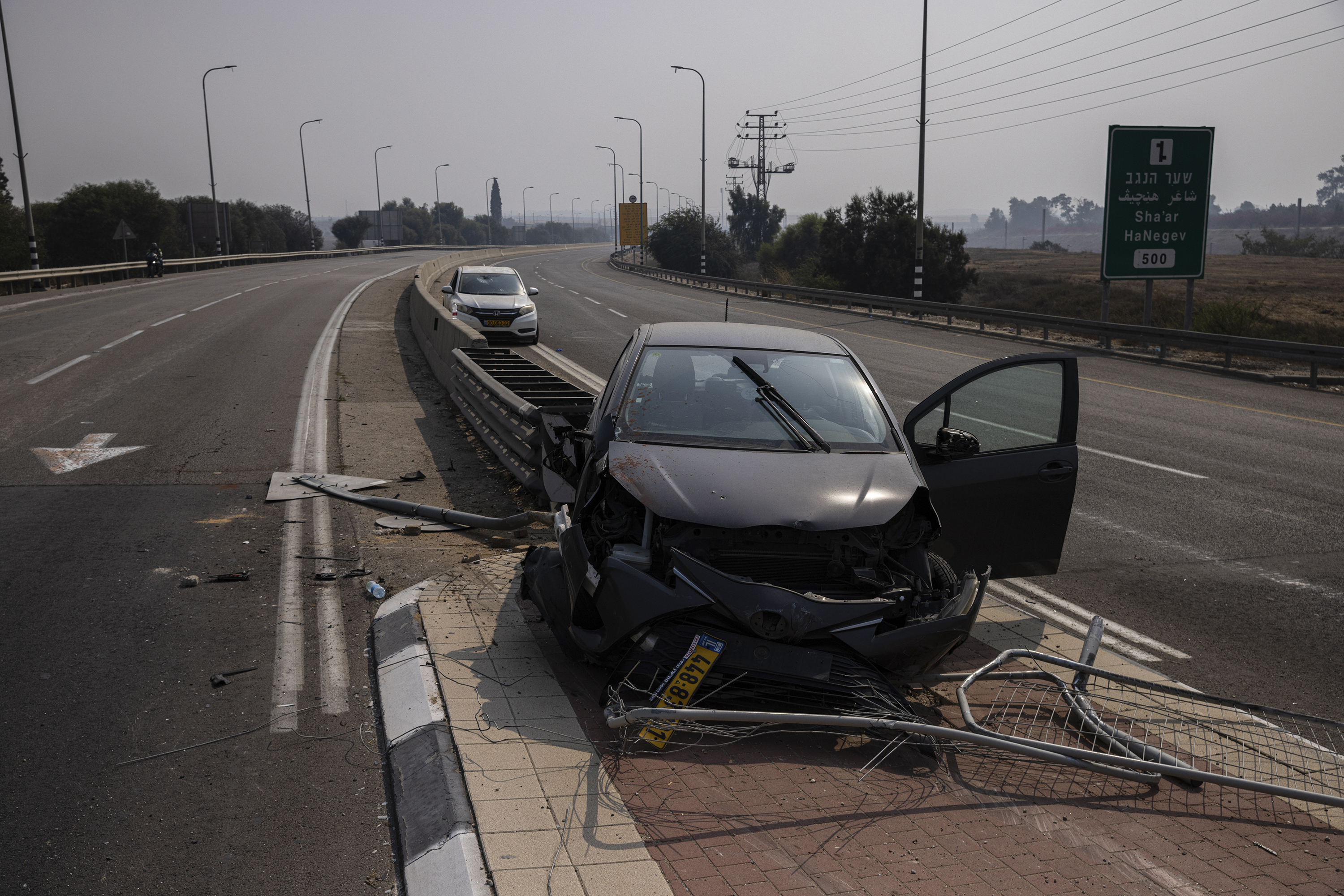 Cars damaged in an attack by Hamas gunmen are seen on a road in Sderot, Israel. Photo / Tamir Kalifa, The New York Times