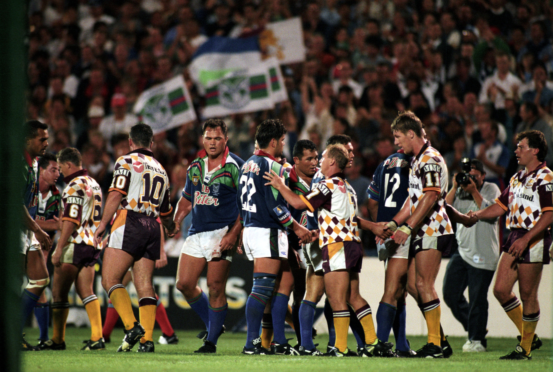 The Warriors congratulate the Brisbane Broncos at the end of the opening game of the 1995 Winfield Cup Competition. Photo / Photosport