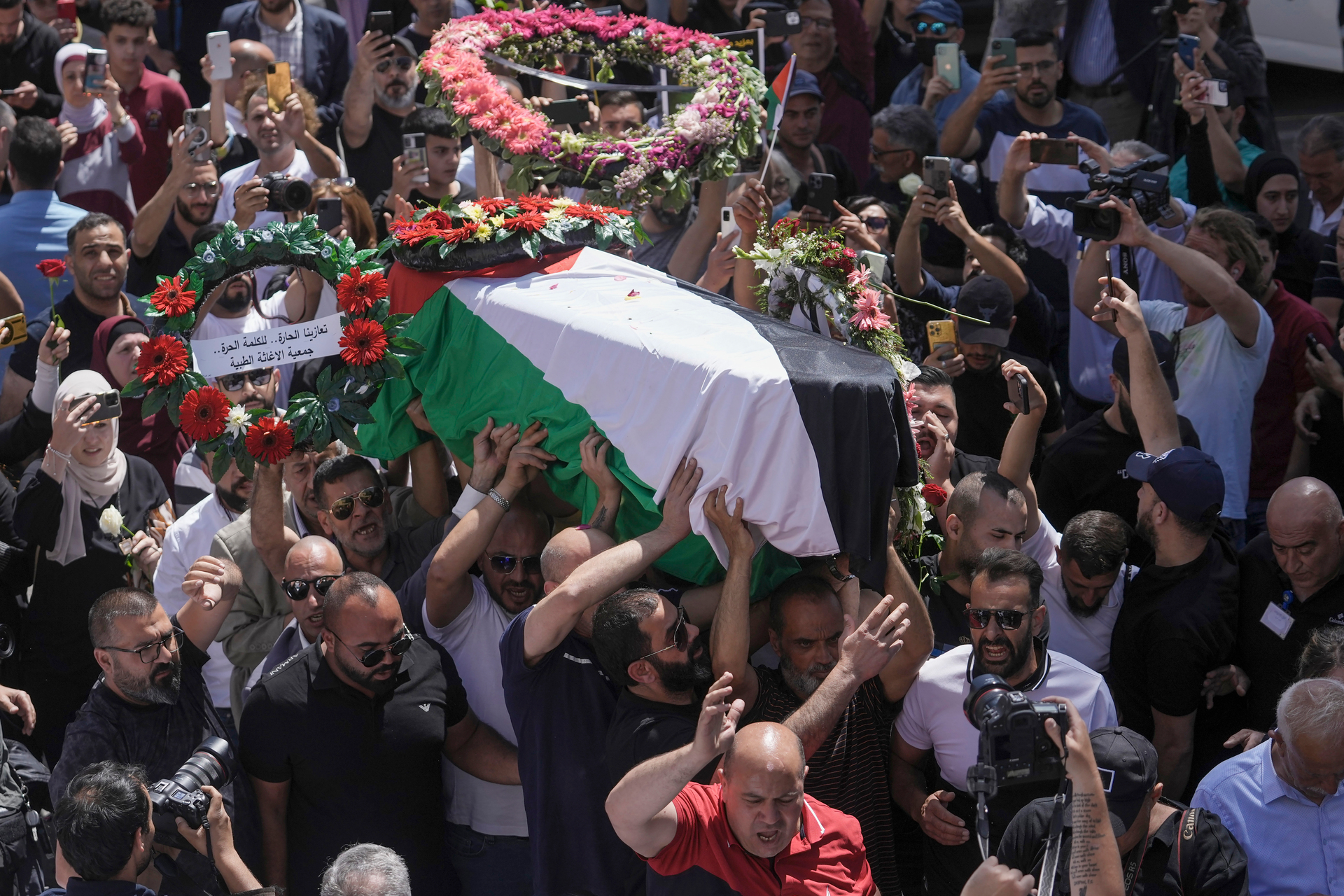 Family, friends and colleagues of slain Al Jazeera journalist Shireen Abu Akleh carry her coffin to a hospital in the east Jerusalem neighbourhood of Sheikh Jarrah. Photo / AP