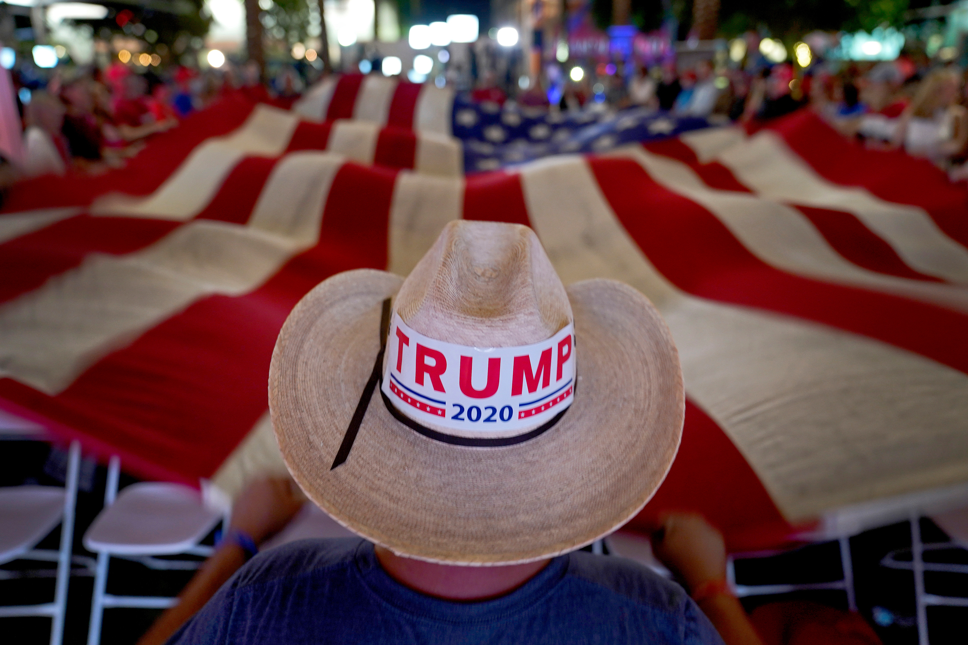 President Trump supporters wave a flag during an election watch party. Photo / AP