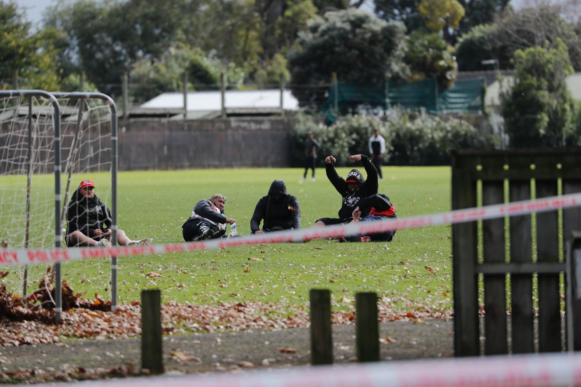 King Cobra gang members gathered outside the police cordon. Photo / Dean Purcell
