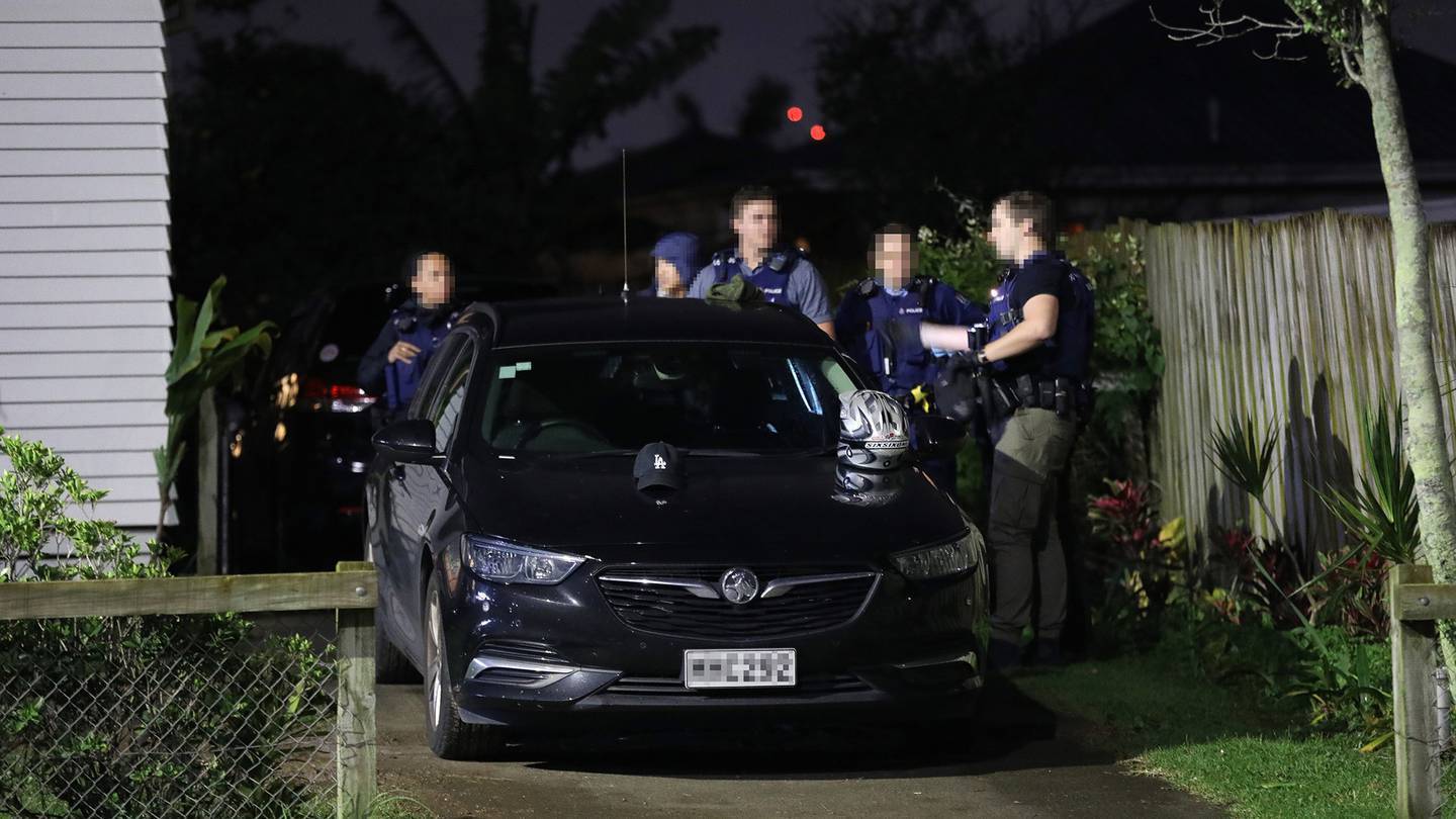 Armed police during a raid on a property at Pt England on Monday night. Photo / Hayden Woodward