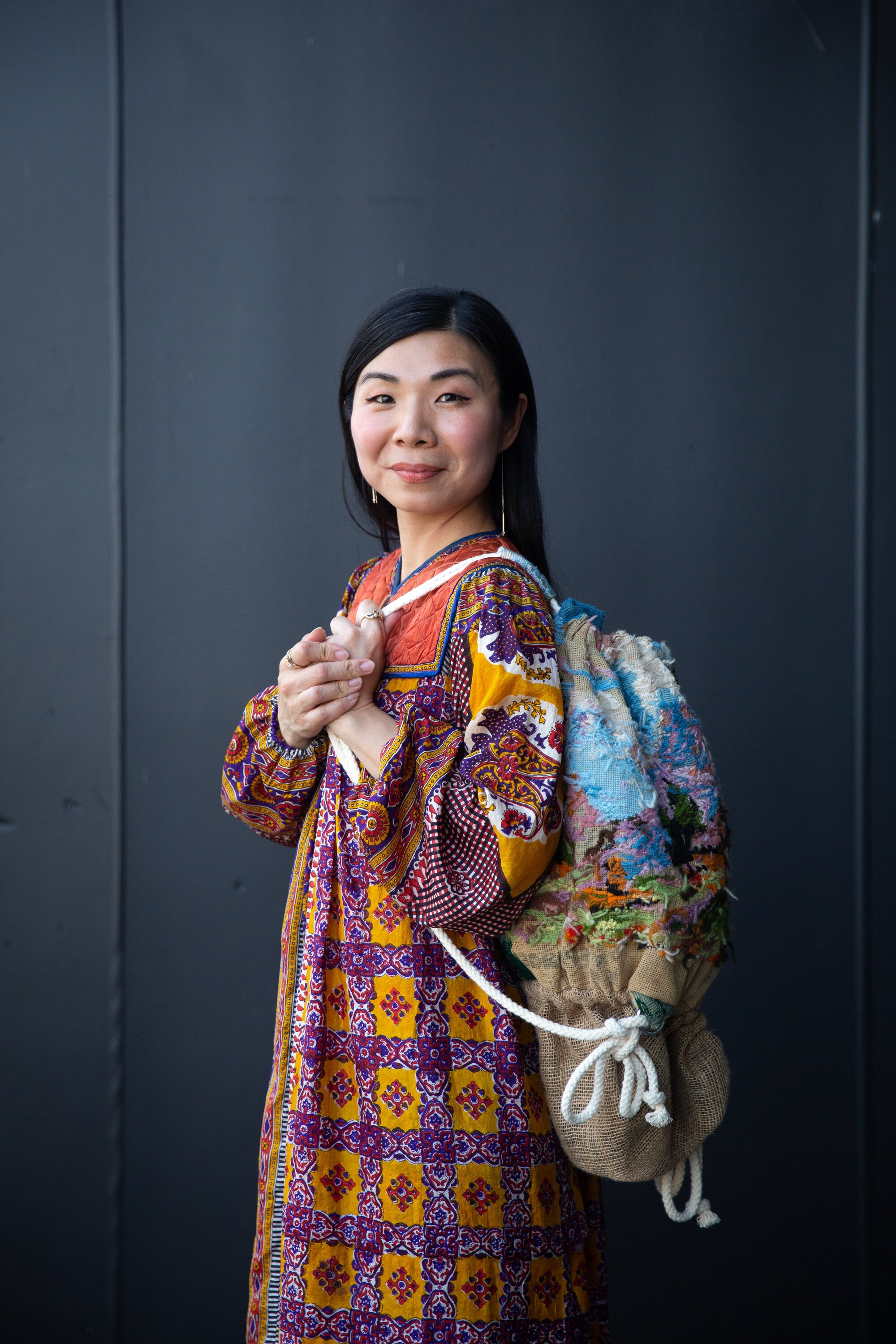 Designer Jacqueline Tsang, wearing the revitalised bag from her award-winning design. Photo / Sylvie Whinray