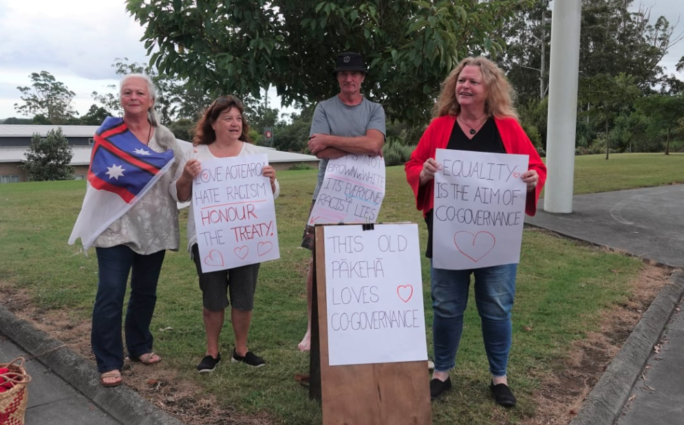 Those opposed to Julian Batchelor's views make their feelings clear outside the meeting in Kerikeri. Photo / RNZ, Sam Olley