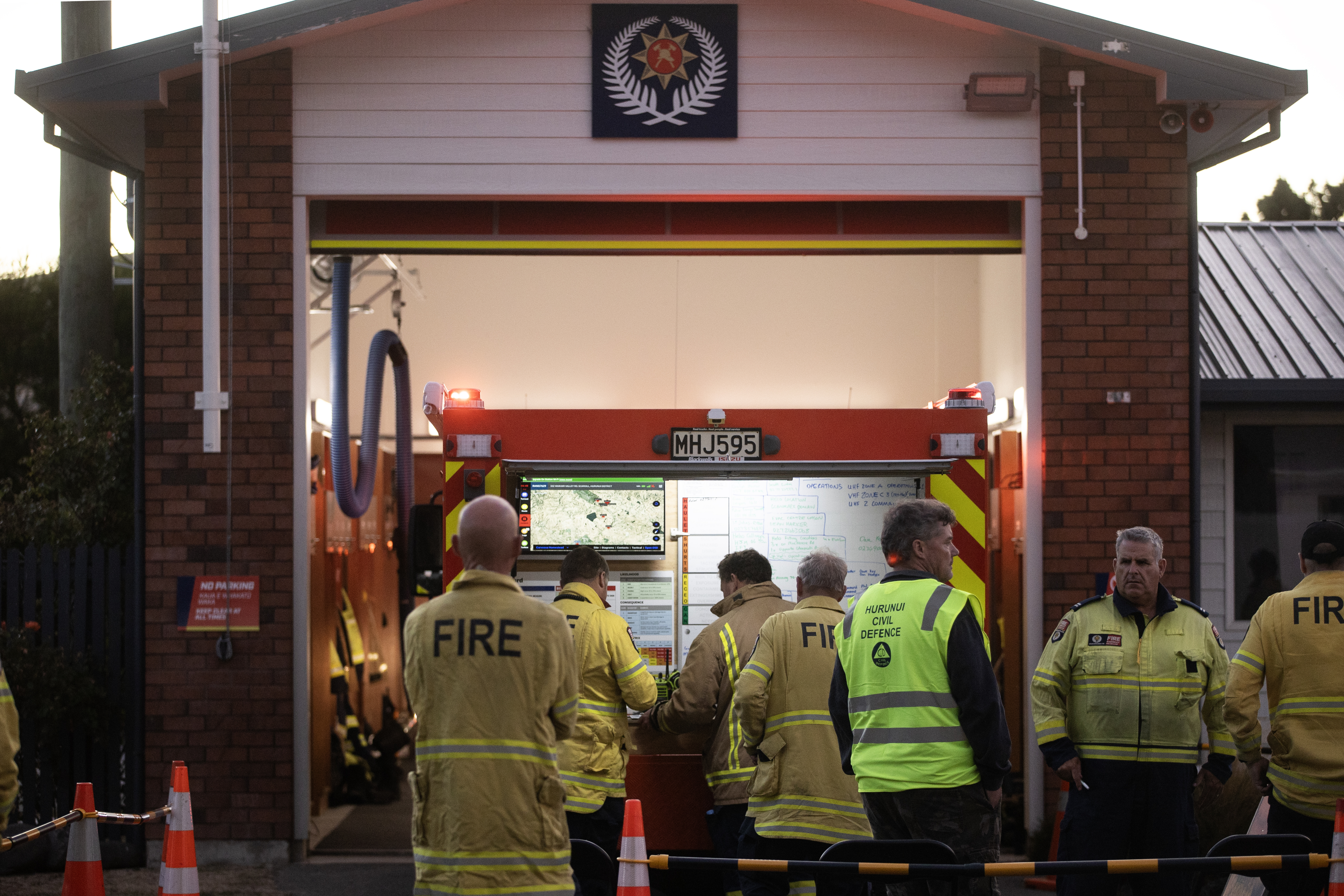 Firefighters gather at the command point set up at the Waipara Fire Station in North Canterbury. Photo / George Heard