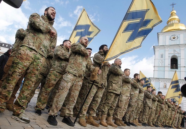 Ukrainian veterans of the Azov volunteer battalion attend a rally. Photo / Getty Images