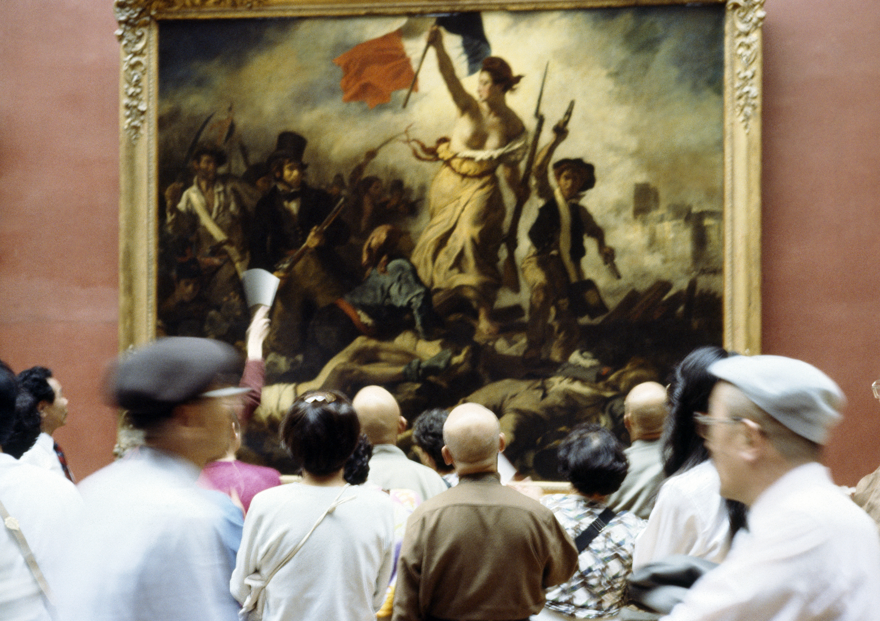 Crowds gather around Eugene Delacroix's painting, Liberty Leading the People, an allegory of France’s Revolution of 1830 and an emblem of Romanticism. Photo / Getty Images