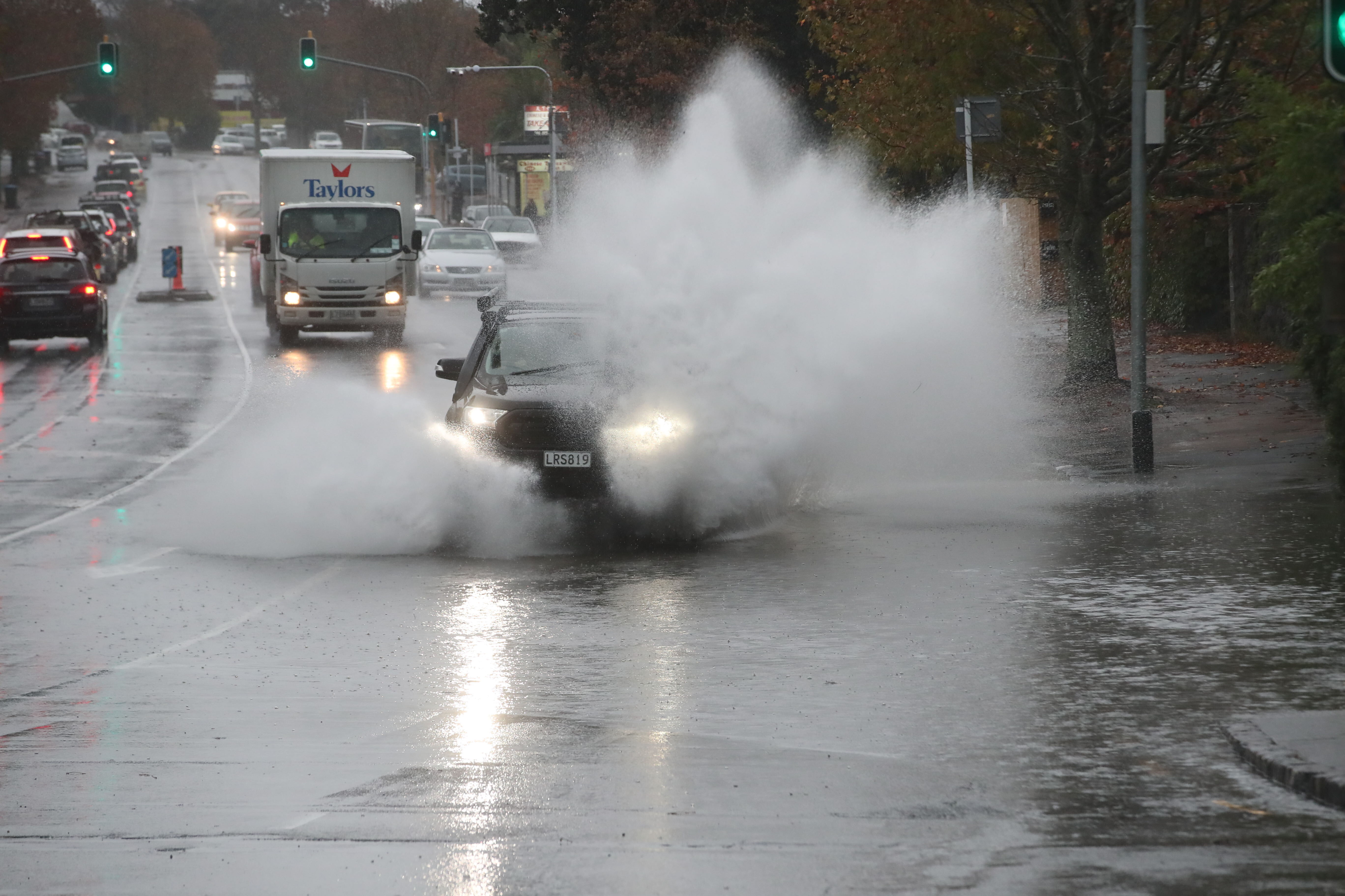 Motorists are battling surface flooding on Great North Rd at Western Springs. Photo / Jason Oxenham