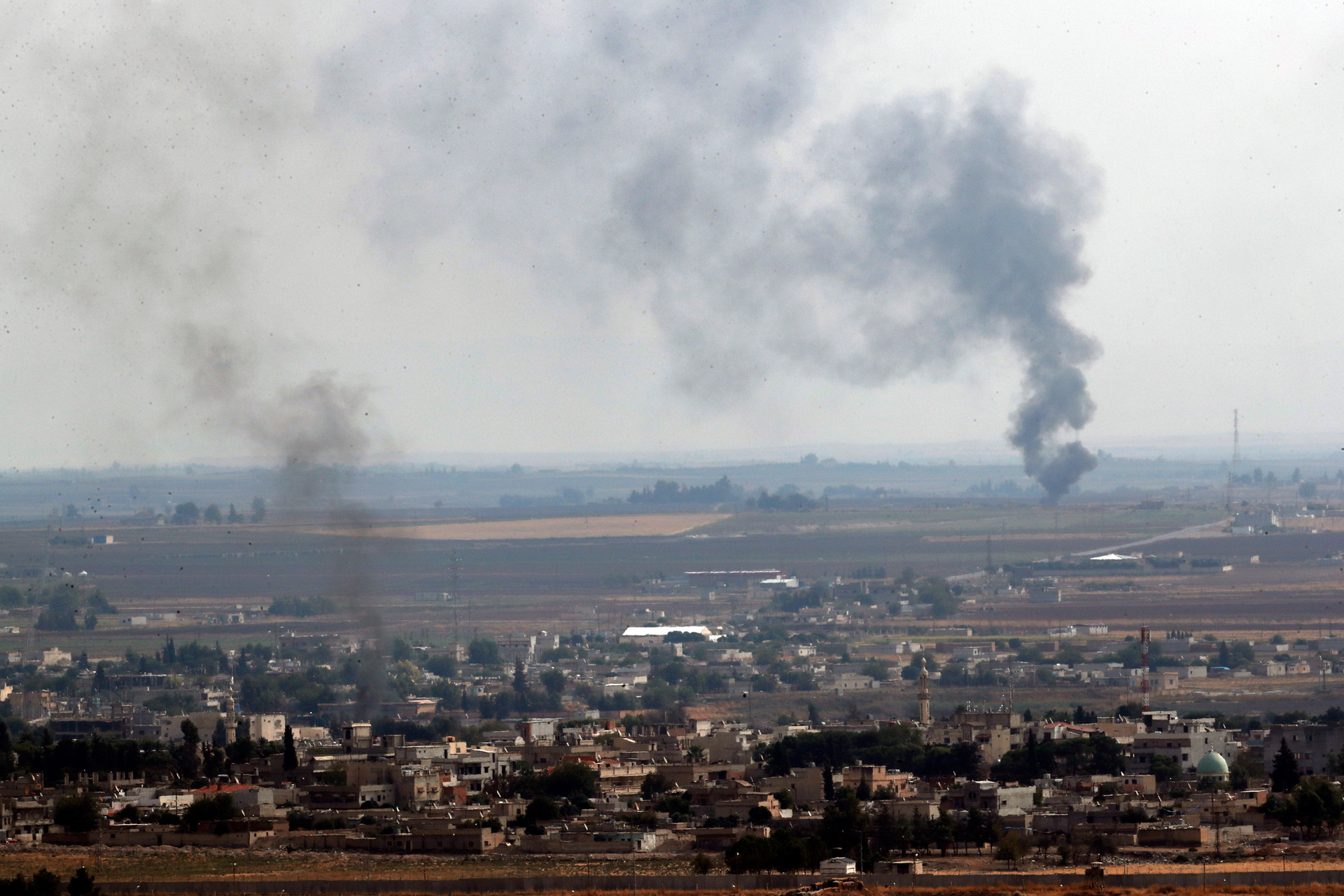 In this photo taken from the Turkish side of the border between Turkey and Syria, in Ceylanpinar, Sanliurfa province, southeastern Turkey, smoke billows from fires in Ras al-Ayn. Photo / AP