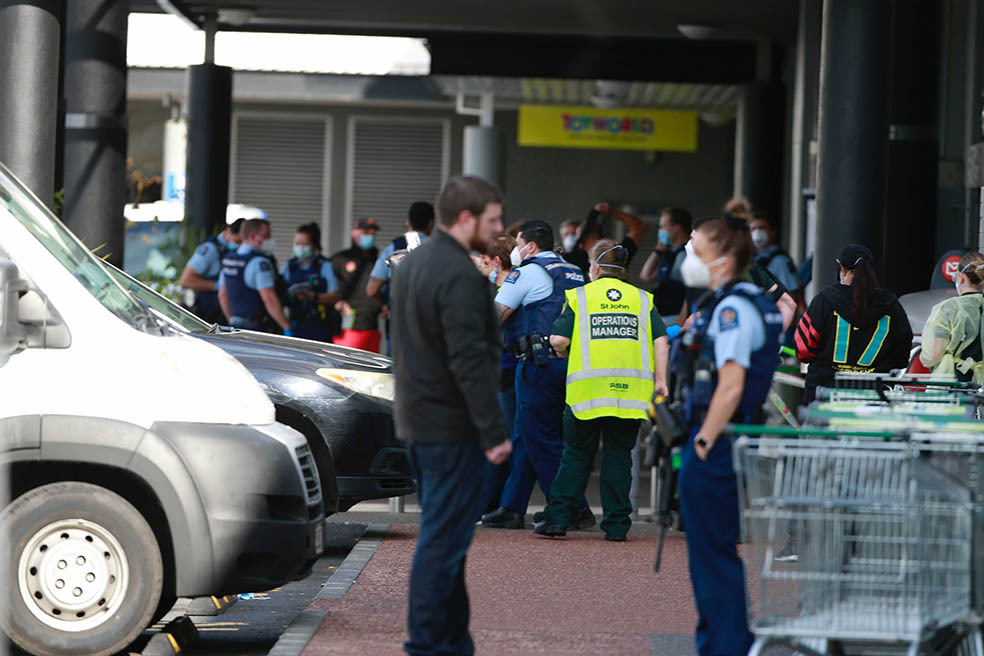 Ross Tomlinson outside Lynn Mall being spoken to by a police officer on the day of the stabbing terror attack on September 3, 2021. Photo / Alex Burton