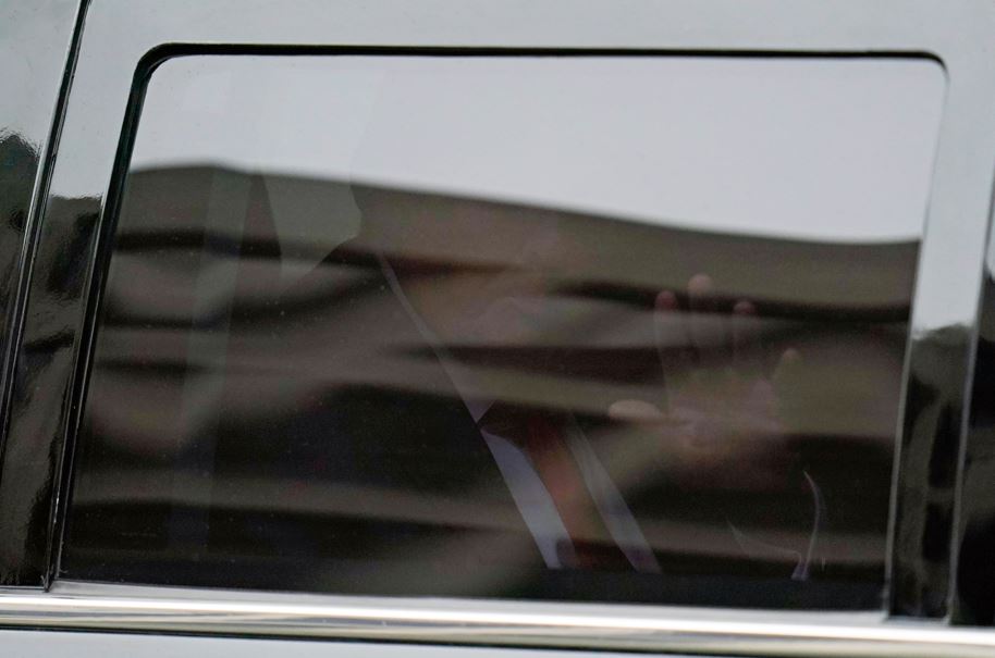 Donald Trump waves from his motorcade as he leaves the E. Barrett Prettyman US Federal Courthouse. Photo / AP