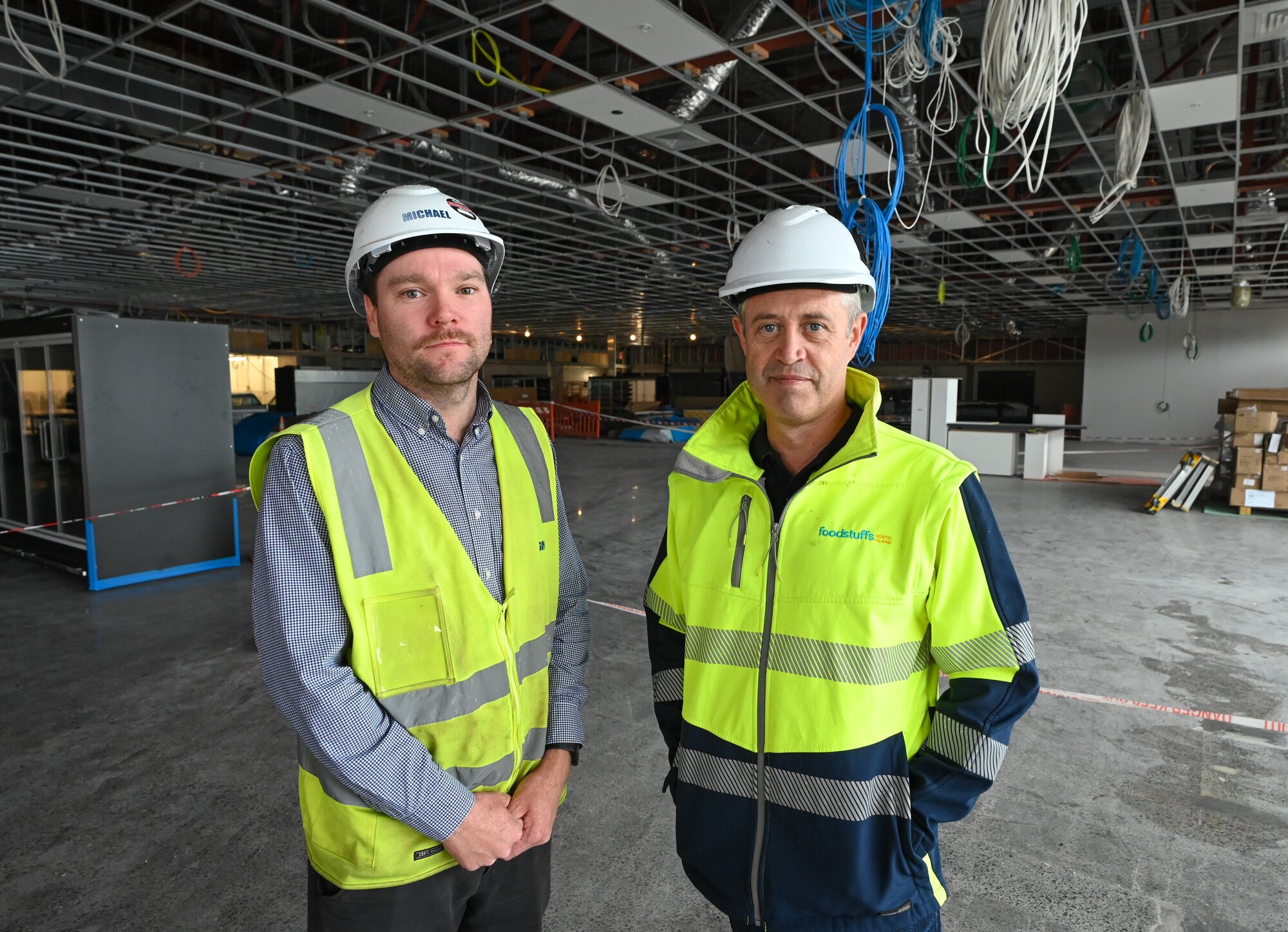  Michael Lowdon (left) of GN Construction and Nick Hanson (right) of Foodstuffs North Island in the new $50m New World Te Atatū. Photo / Foodstuffs