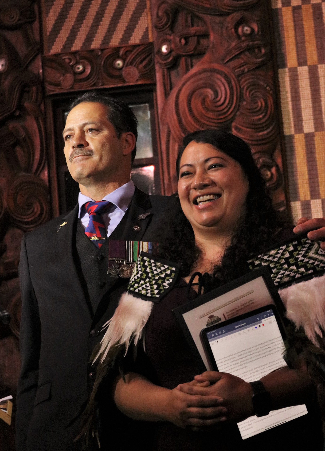 Victoria Cross recipient Willie Apiata congratulates scholarship winner Leigh Albert during yesterday's ceremony at the Treaty Grounds. Photo / Peter de Graaf