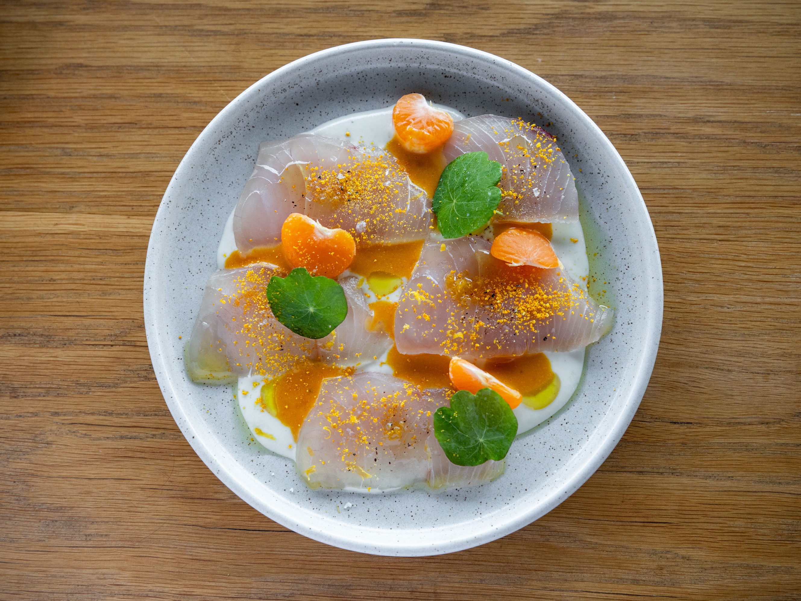 Cured raw fish, white gazpacho, grapefruit and orange dressing, and mandarin from Parro on Dominion Rd. Photo / Babiche Martens
