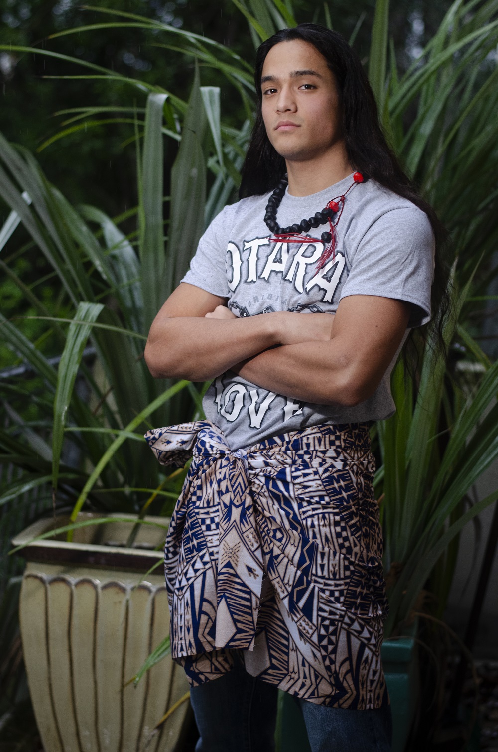 HUMOUR ME: Hezekiah wears Sam’s Island Gear ‘Otara Love’ T-shirt (2019). Alan Preston banana seed necklace (2017). Workshop jeans (2017). Lavalava from Tanoa. Photo / Edith Amituanai