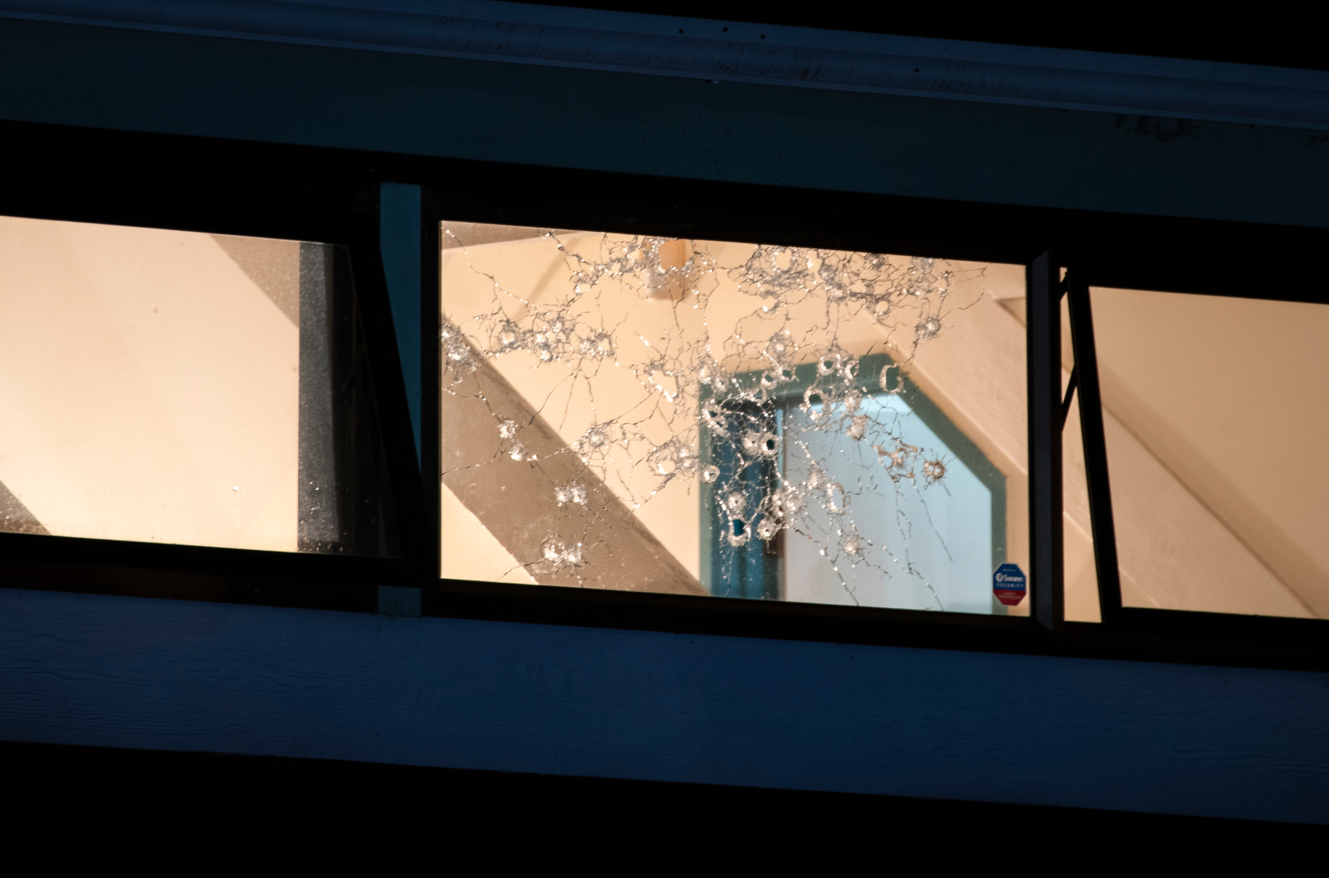 A home in Phoenix Pl, Papatoetoe was riddled with bullets on Sunday night. Photo / Hayden Woodward 