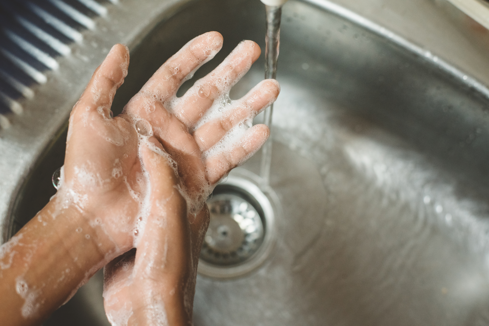 Washing with soap and water is recommended over using hand sanitiser, which does not kill the parasite. Photo / Hafiez Razali