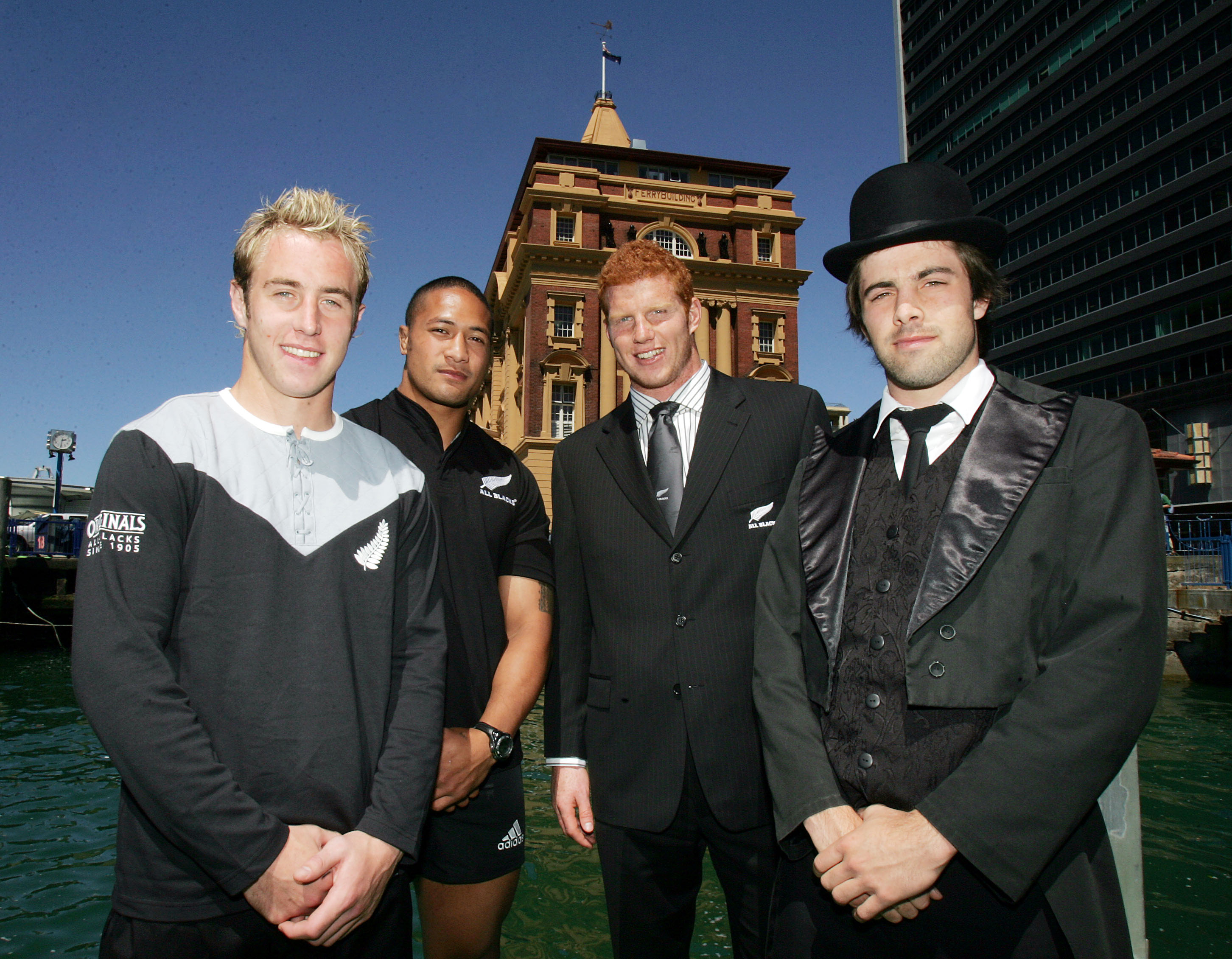 Jimmy Cowan (from left), Mose Tuiali'i, James Ryan and Conrad Smith wear gear from the 1905 All Black Originals team and the 2005 All Blacks outfitting. Photo / Photosport