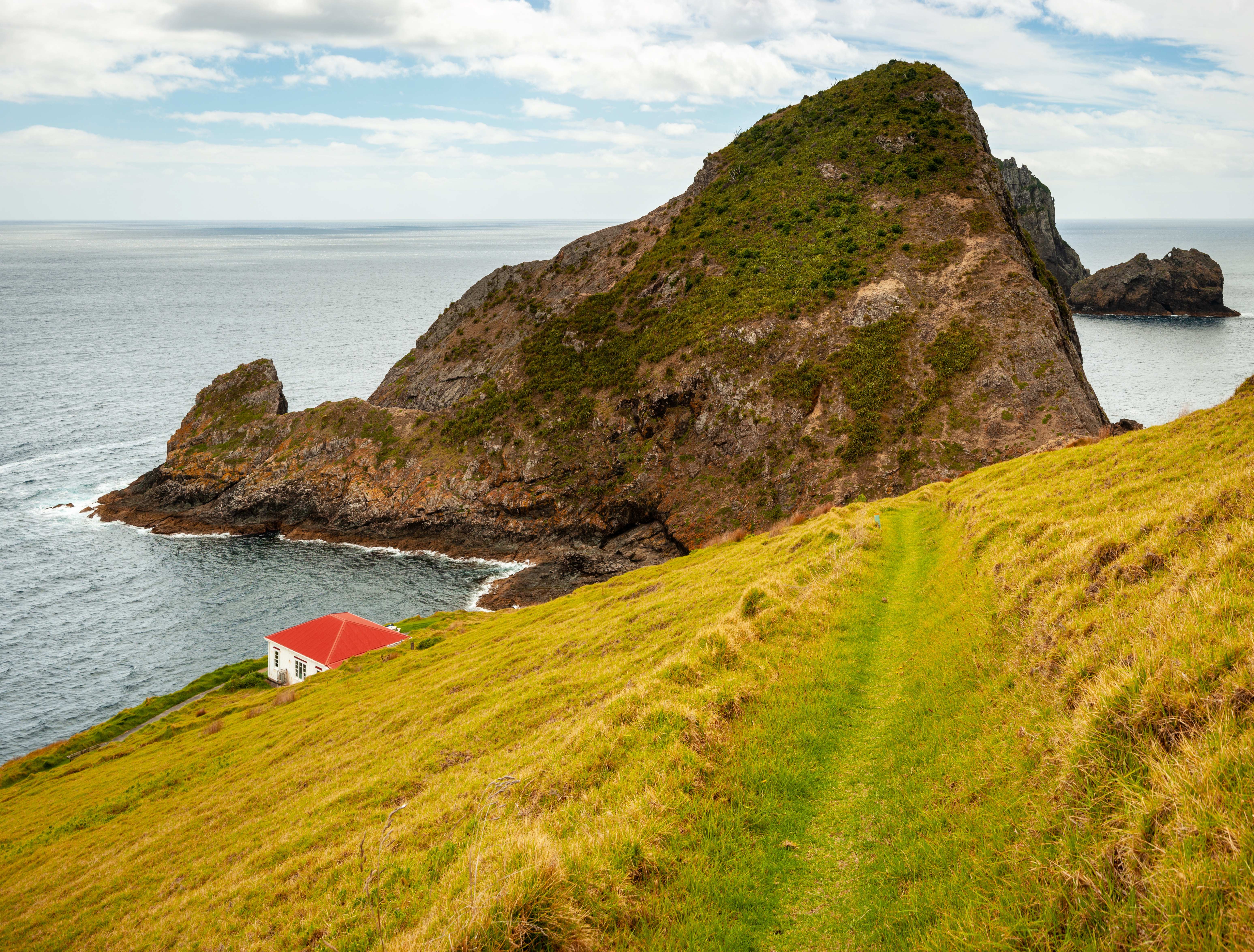 Cape Brett Hut, Cape Brett Scenic Reserve, Bay of Islands, Northland. Photo / Shaun Barnett