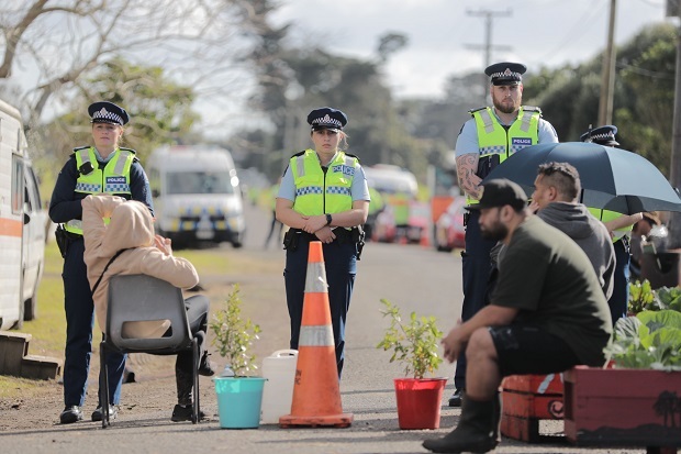Protestors and Police at the Ihumatao housing project in Mangere. Photo / Michael Craig