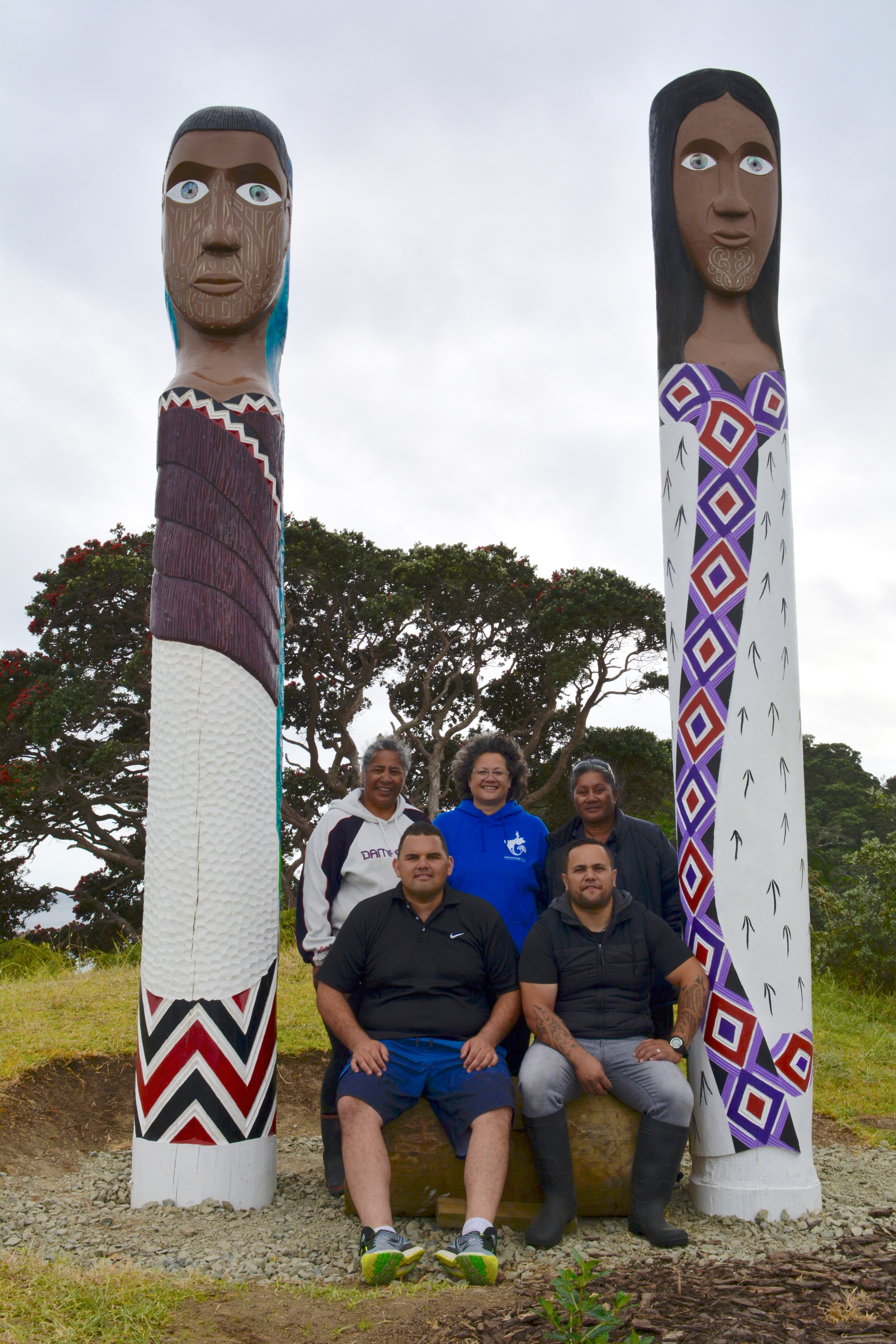 Haititaimarangai Marae rahui subcommittee members with pou representing Te Whanau Moana and Te Rorohuri tupuna Kahutianui and Te Parata. PHOTO / CHERYL BAMBER