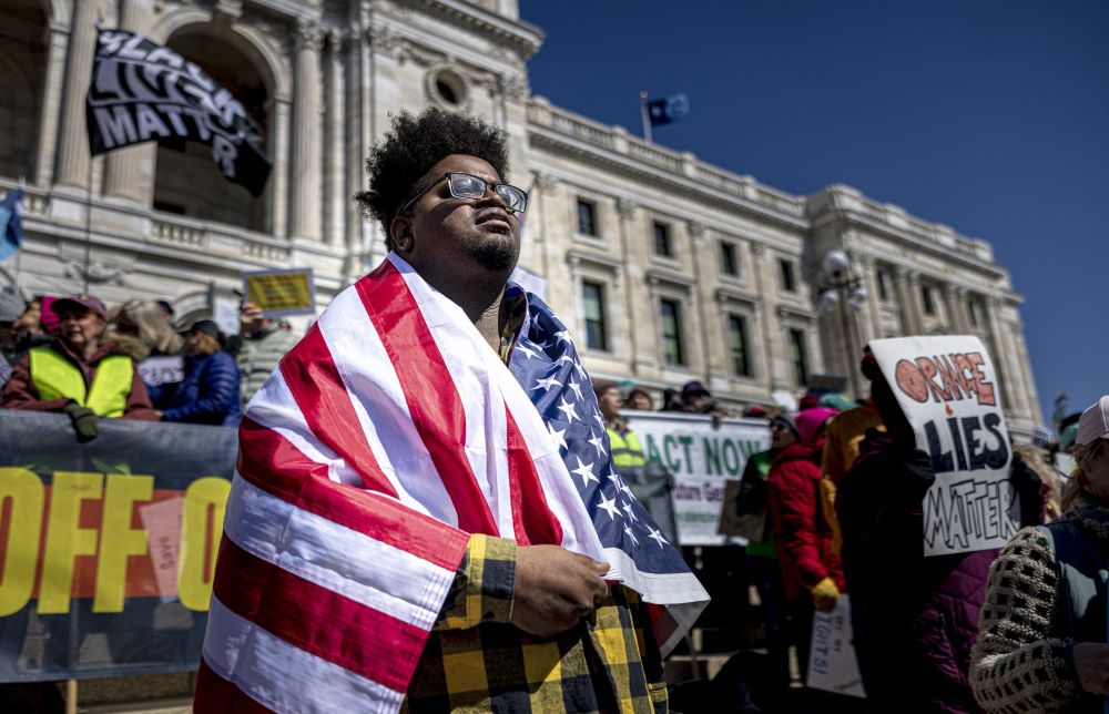 Demonstrators gather outside the Minnesota State Capitol during the nationwide 