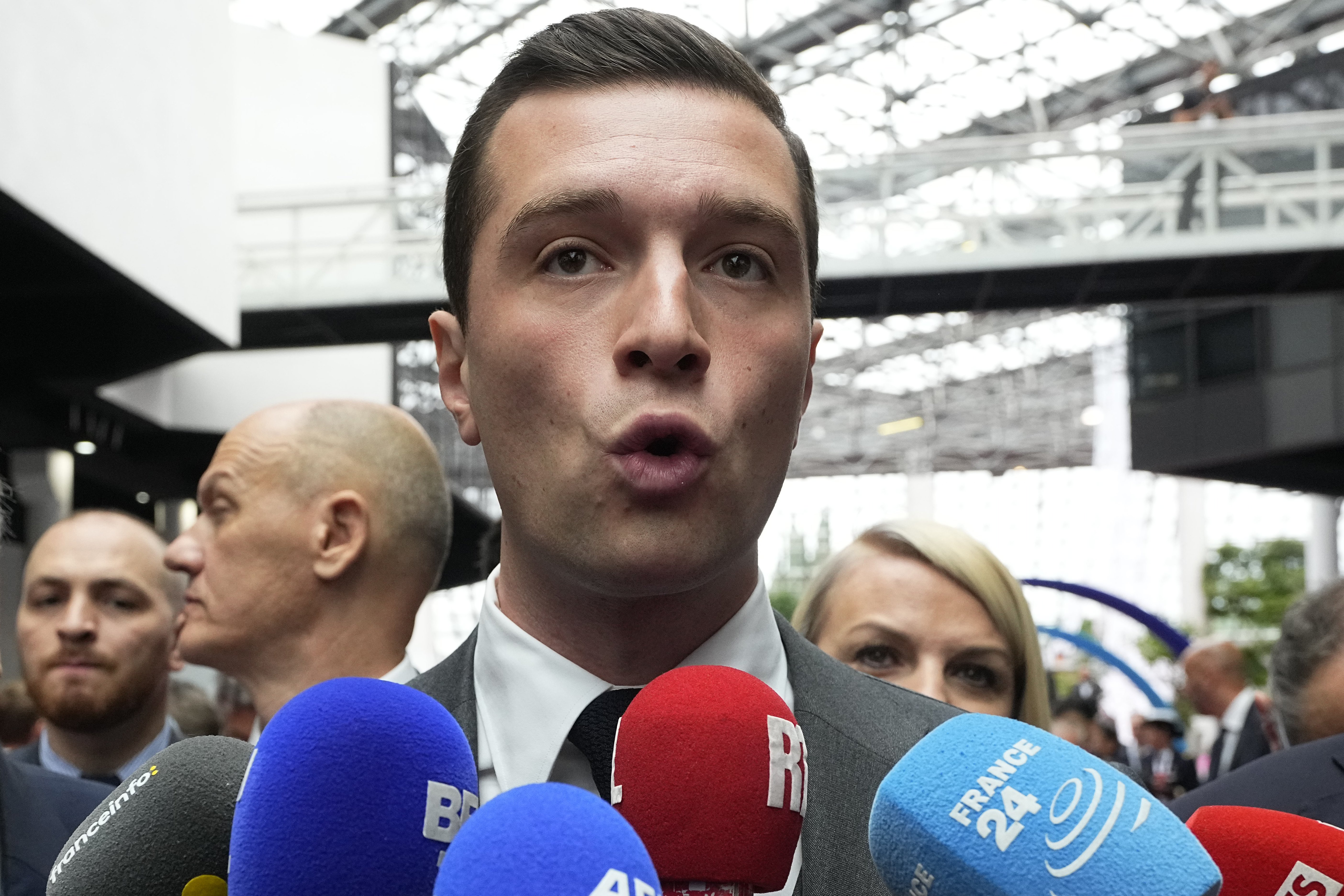 A defeat in parliamentary elections would mean Emmanuel Macron may have to share power with a Prime Minister from a rival political party - that be National Rally's president Jordan Bardella (pictured). Photo / AP