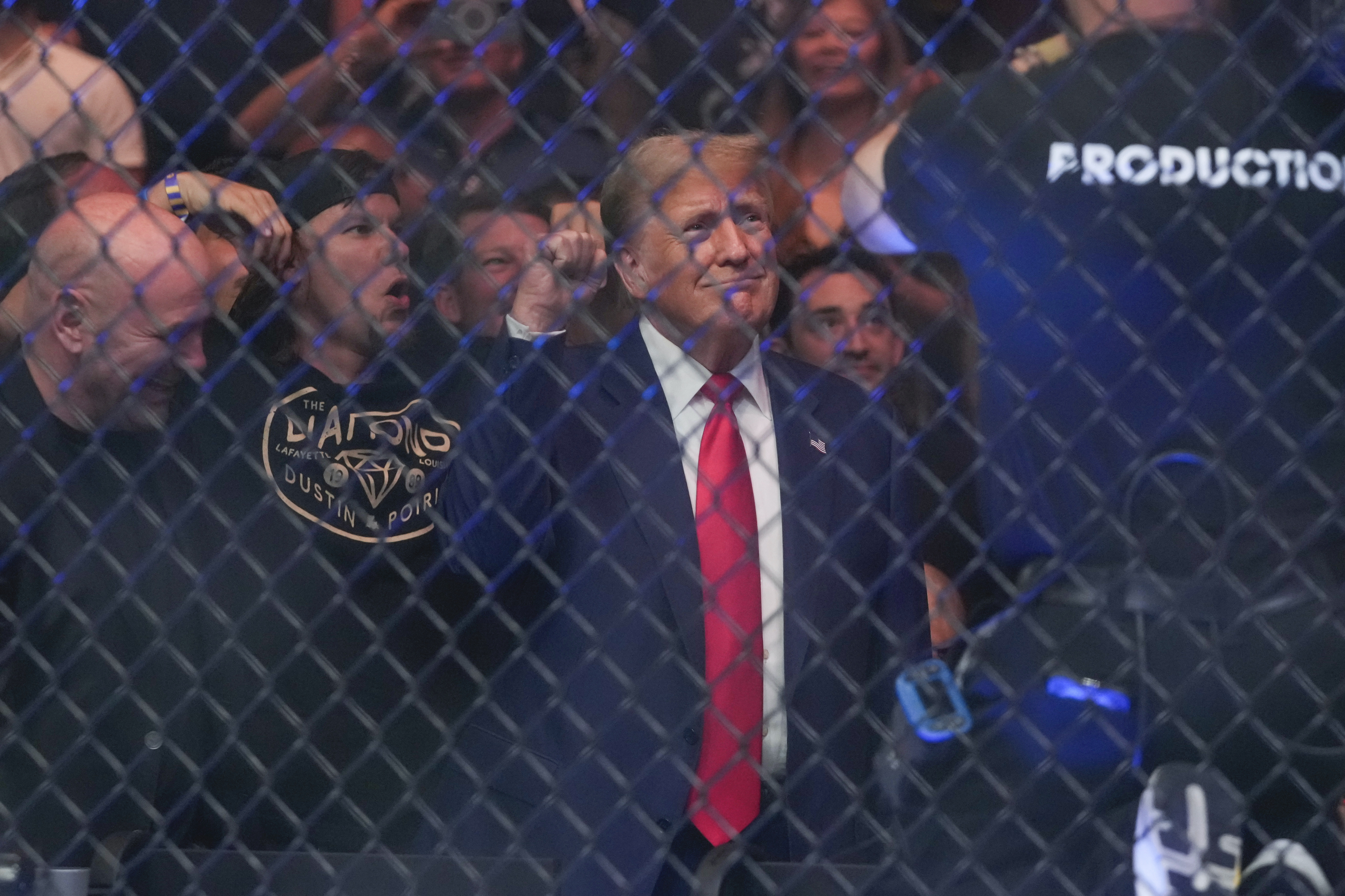 Former President Donald Trump gestures while attending the UFC 302 mixed martial arts event. Photo / AP