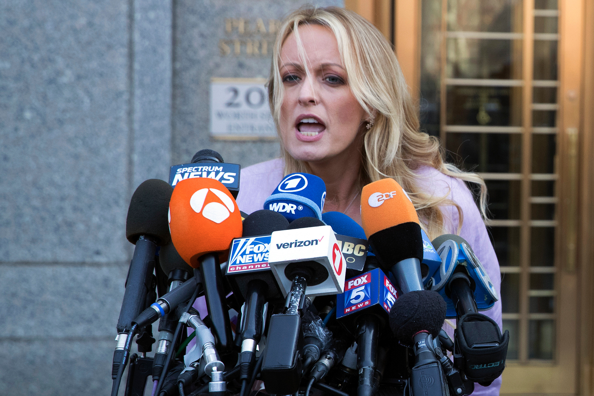 Adult film actress Stormy Daniels speaks outside federal court in New York. Photo / AP