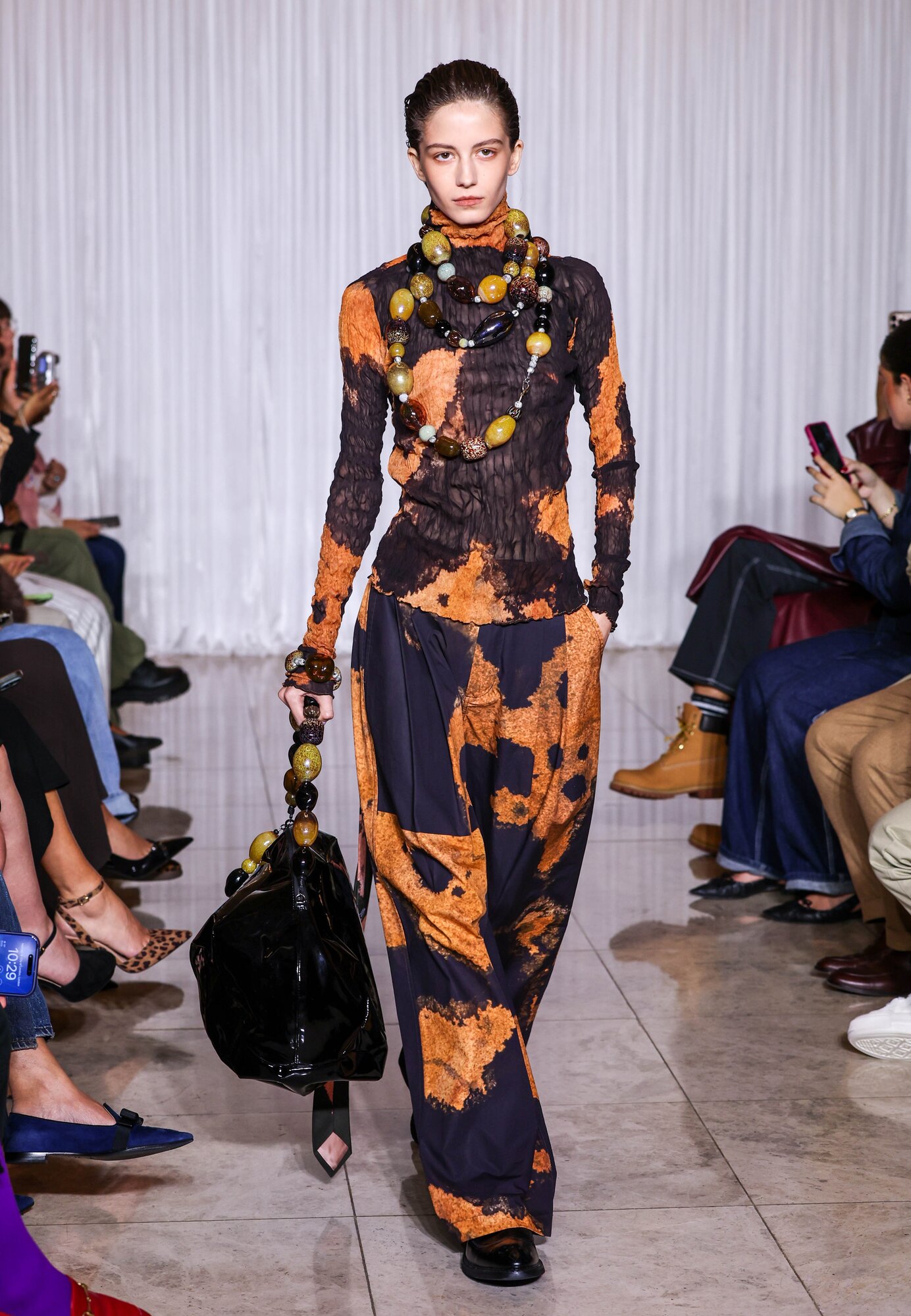 The runway ensembles are embellished with strings of hand-blown glass. Photo / Getty Images